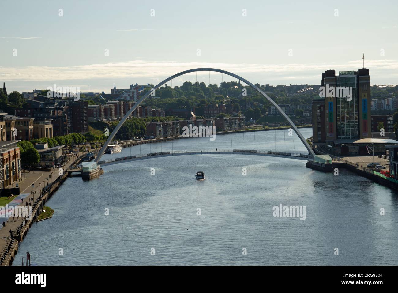 The river Tyne at Newcastle with the Gateshead Millennium Bridge in the distance. It has a pedestrian and cycling path on the bridge only. Stock Photo