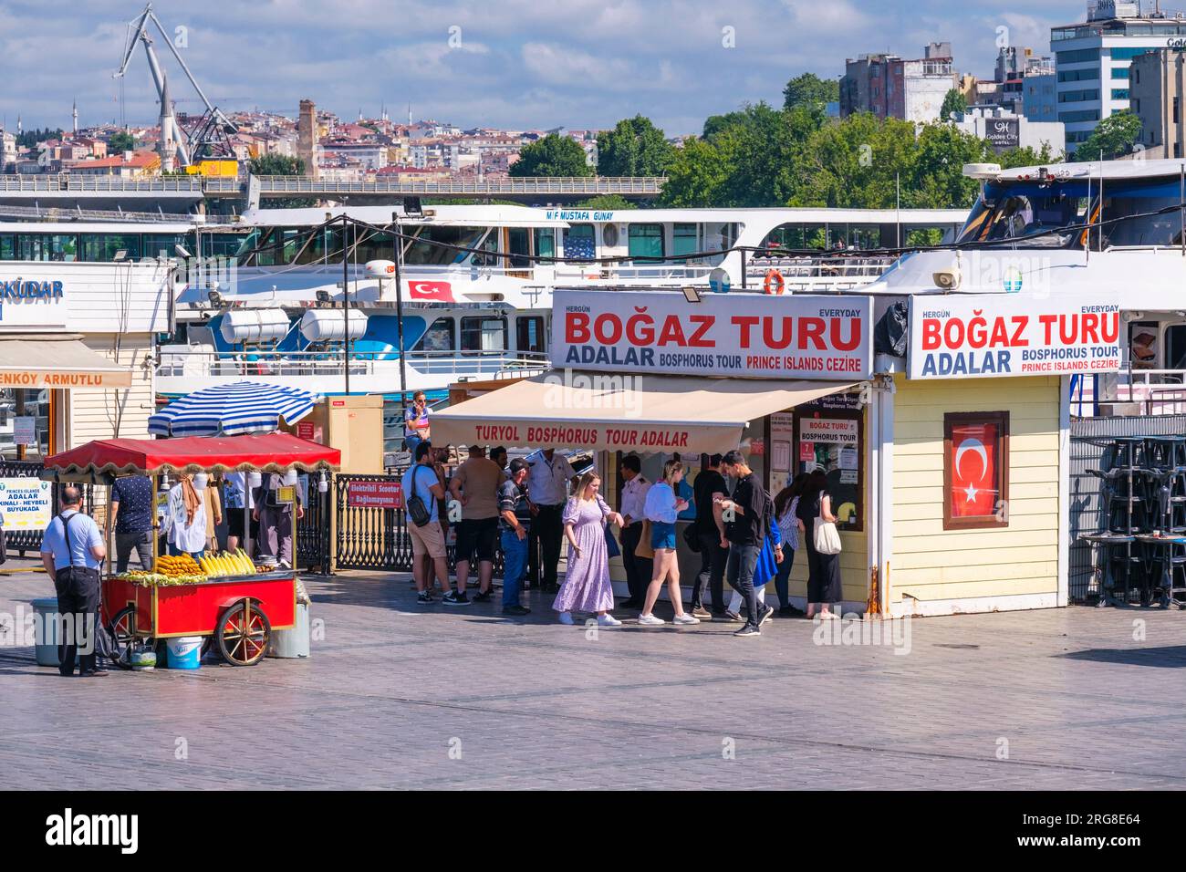 Istanbul, Turkey, Türkiye. Ticket Office for Bosphorus Boat Tours, Refreshment Stand on left Offering Roasted Corn and Chestnuts. Stock Photo