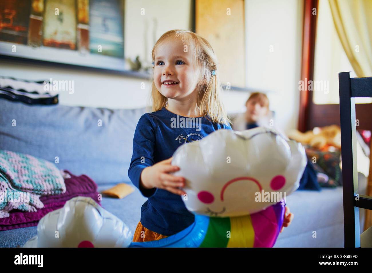 adorable-toddler-girl-having-fun-with-toys-in-playroom-at-home-indoor