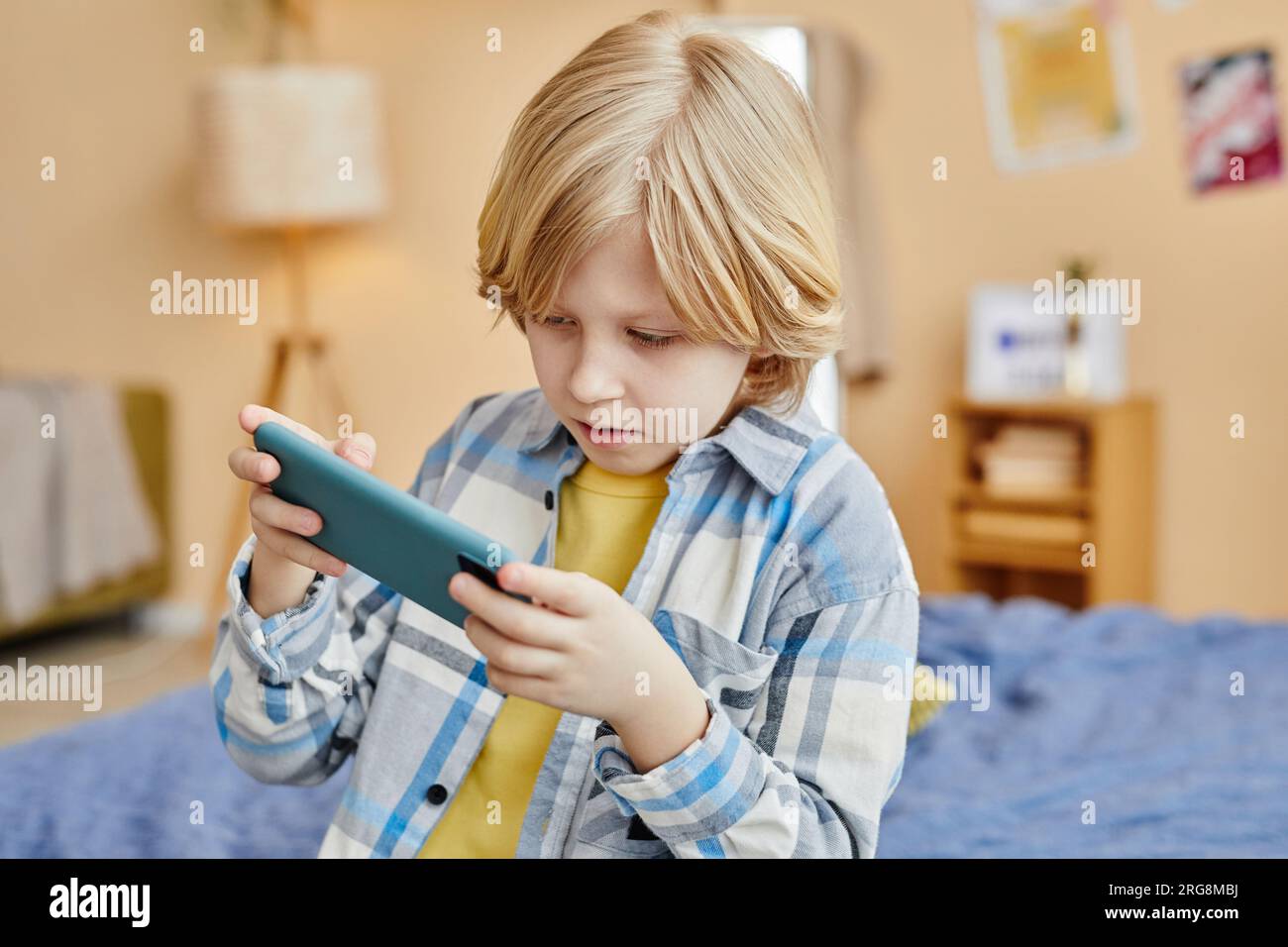 Young girl playing video games on computer after online school and  homework. Gamer using shooting action play for entertainment and fun with  keyboard and monitor. Child enjoying game Stock Photo - Alamy