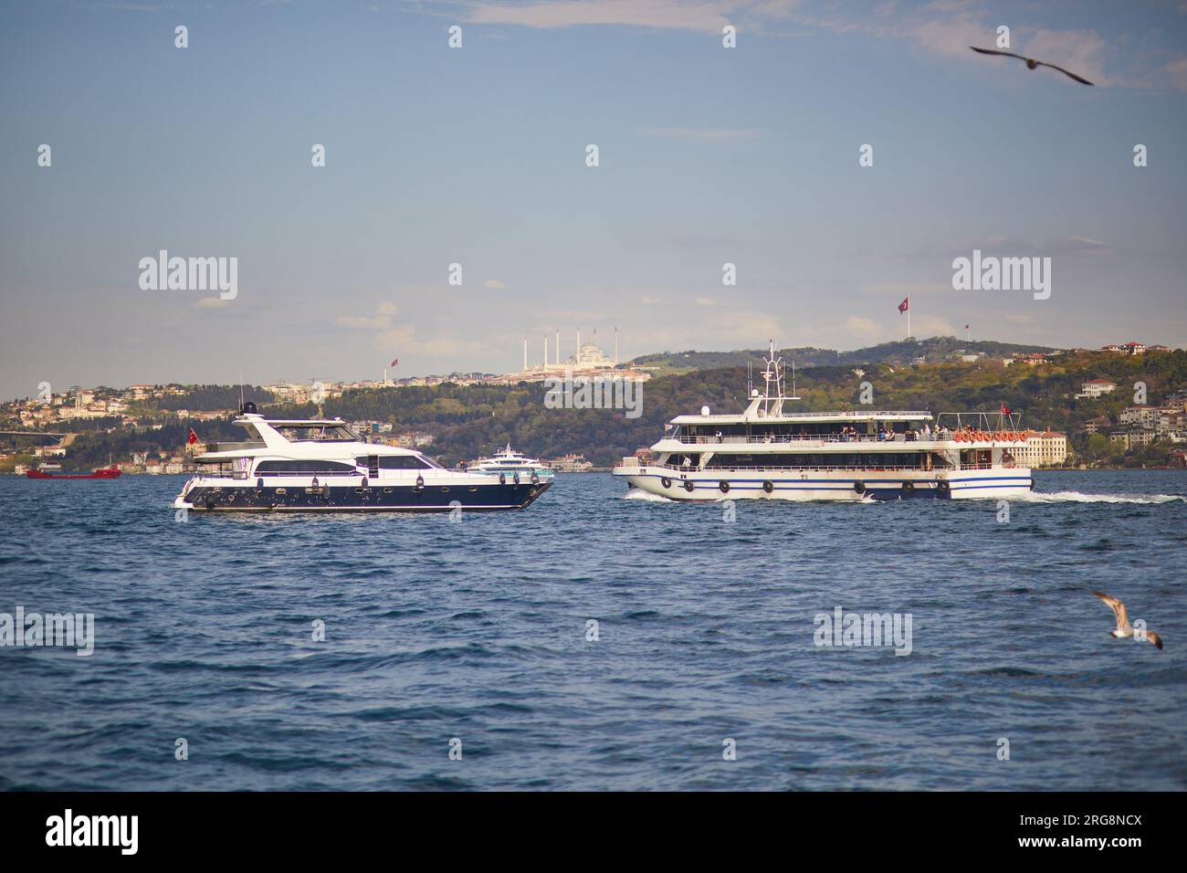 Passenger ferry sails across the Bosphorus strait in Istanbul, Turkey ...