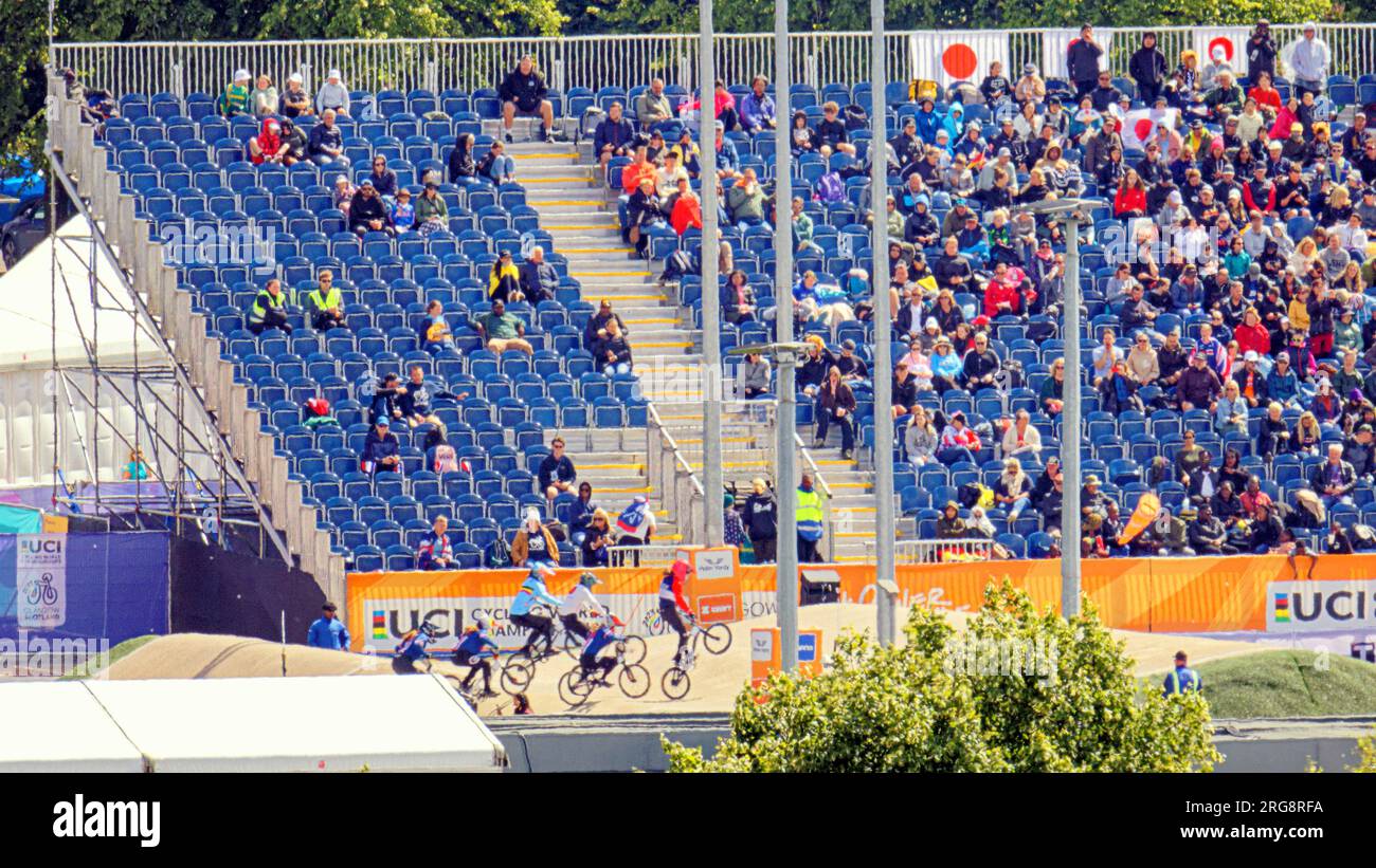 Glasgow, Scotland, UK. 8th  August, 2023. UCI BMX site Knightswood showing participants and the crowd seated in the grandstands. Credit Gerard Ferry/Alamy Live News Stock Photo