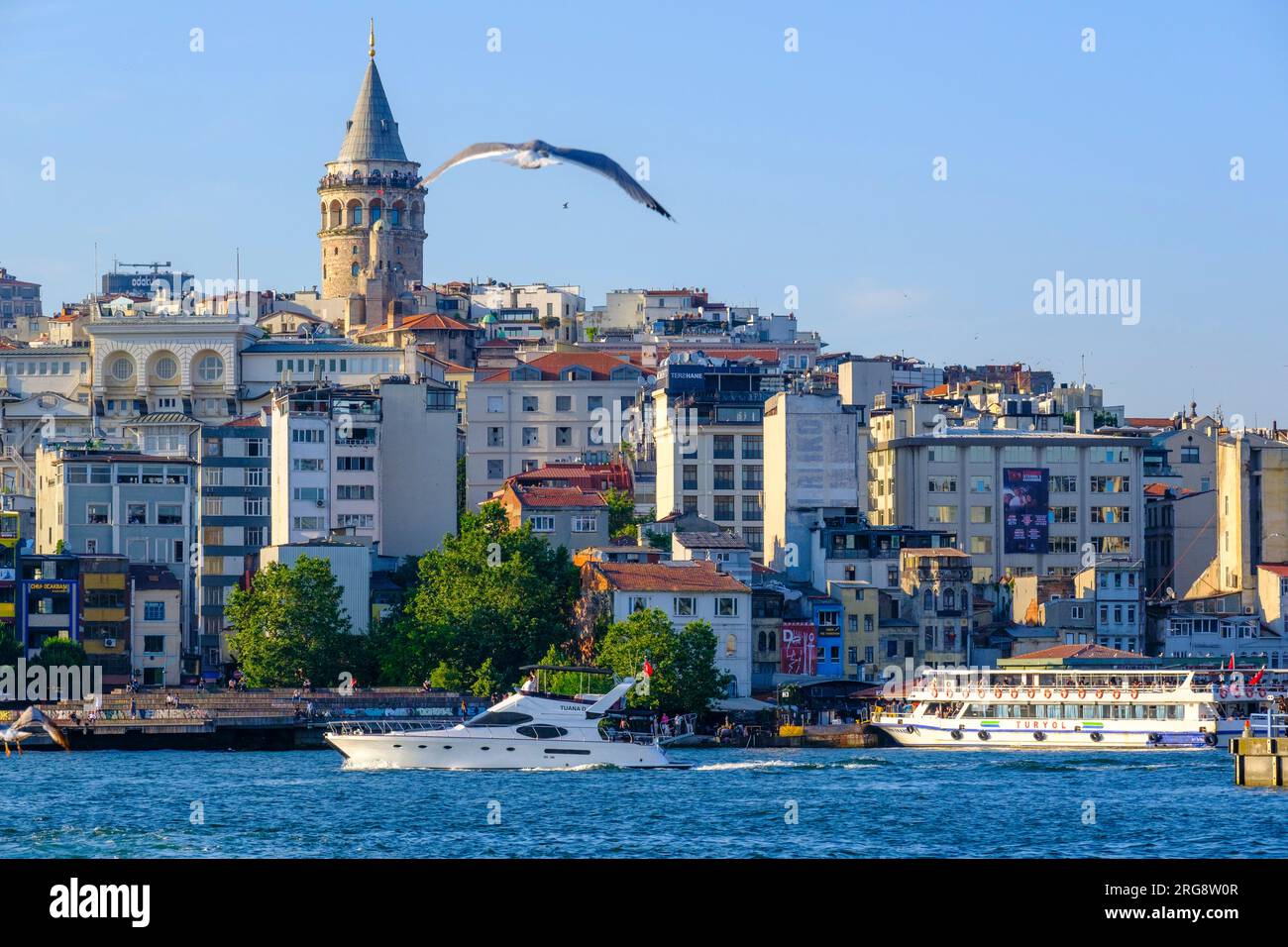 Istanbul, Turkey, Türkiye Galata Tower, Ferries, and Karakoy District seen across the Golden Horn from Eminonu. Stock Photo