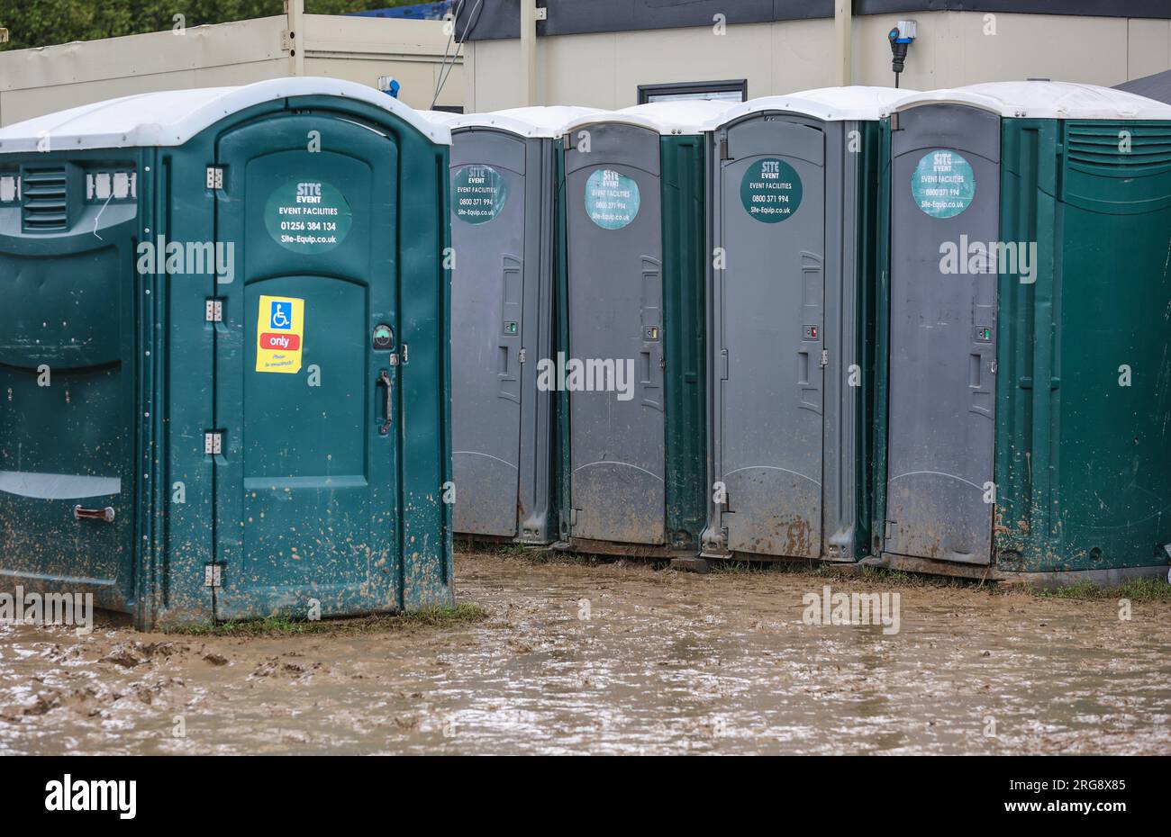 Festival toilets at a muddy festival in the UK Stock Photo