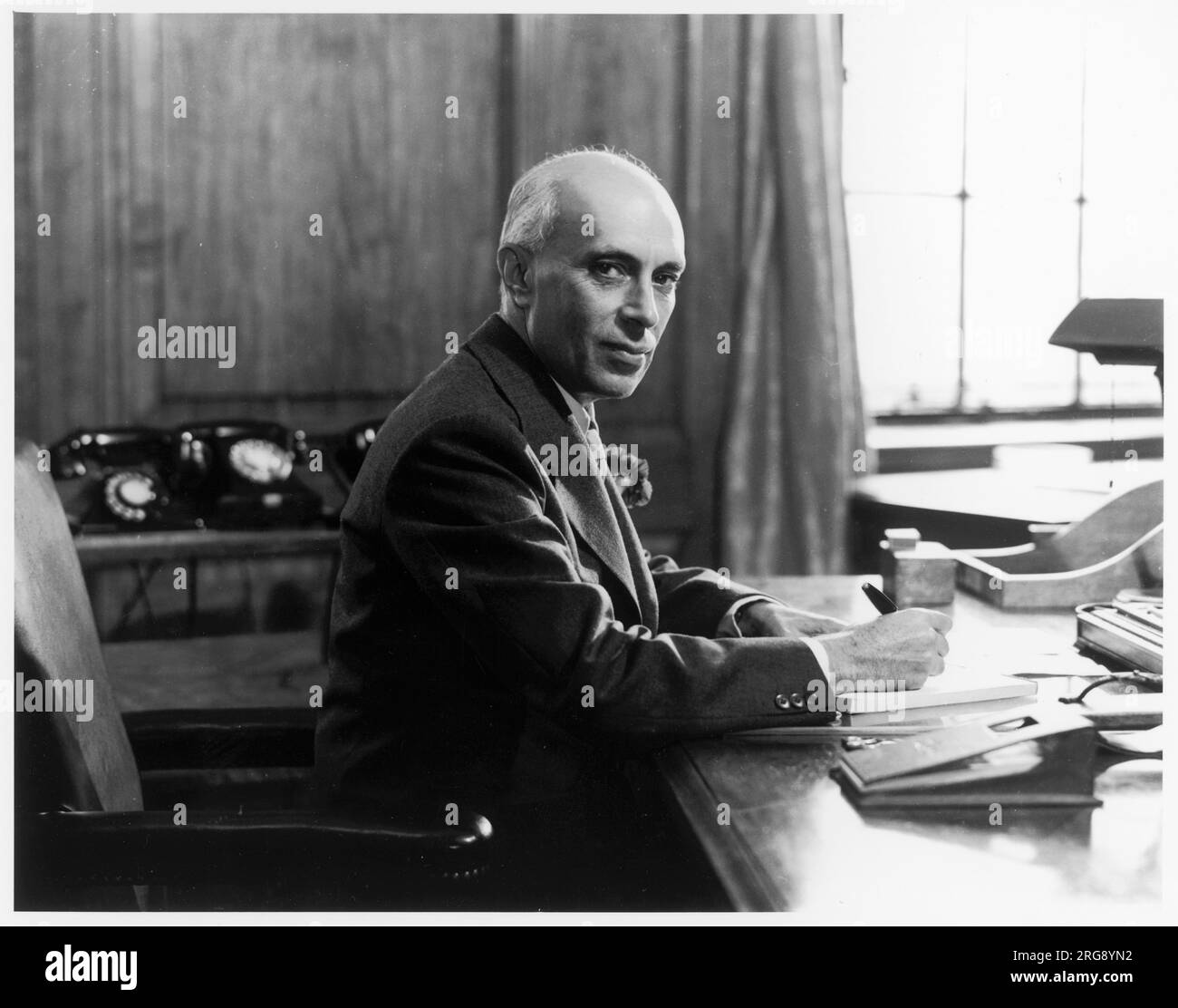 Jawaharlal (Pandit) Nehru (1889-1964), Indian political leader, seen here sitting at his desk. Stock Photo