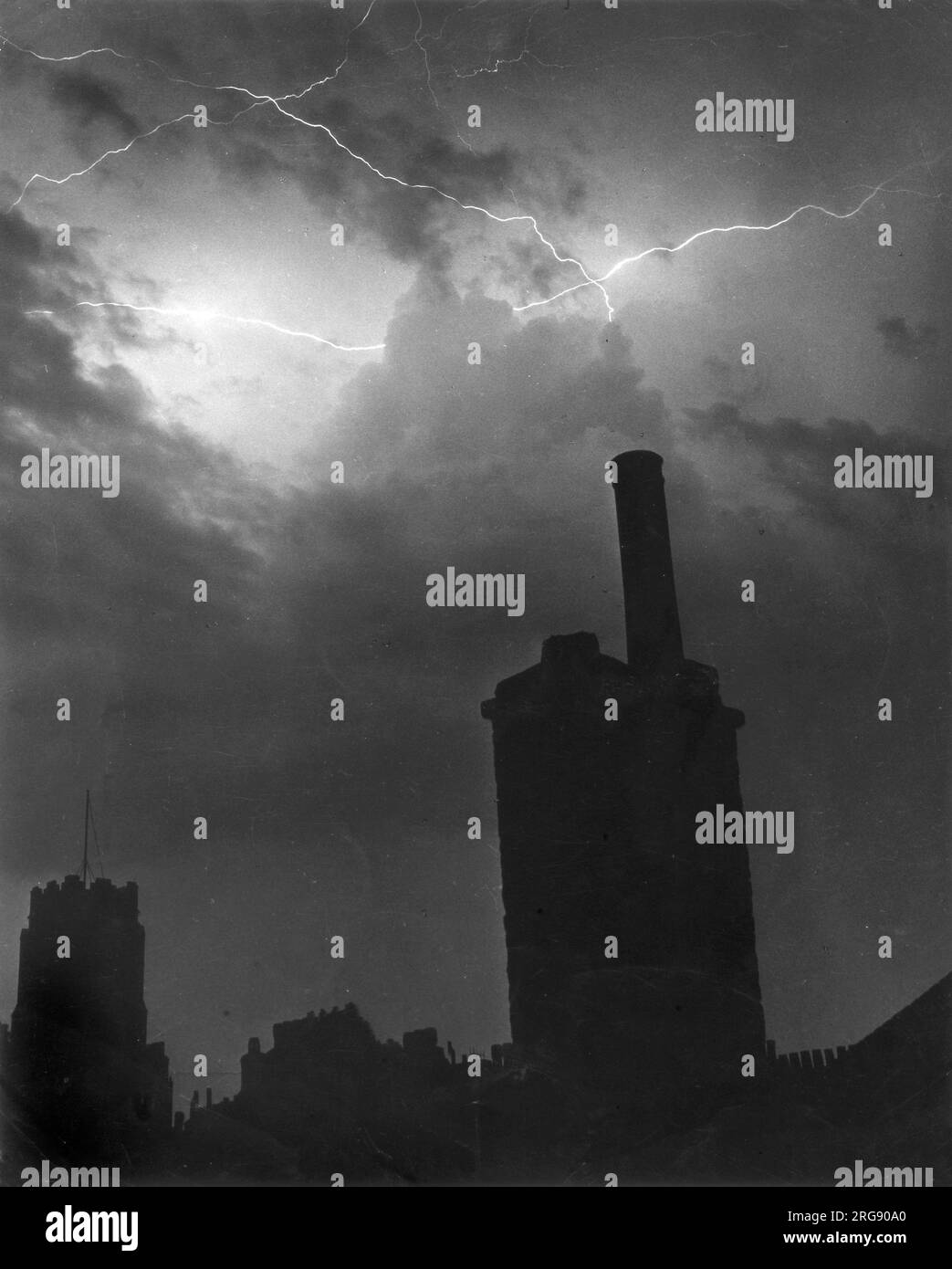 Fork lightning strikes in the skies above chimneystacks Stock Photo - Alamy