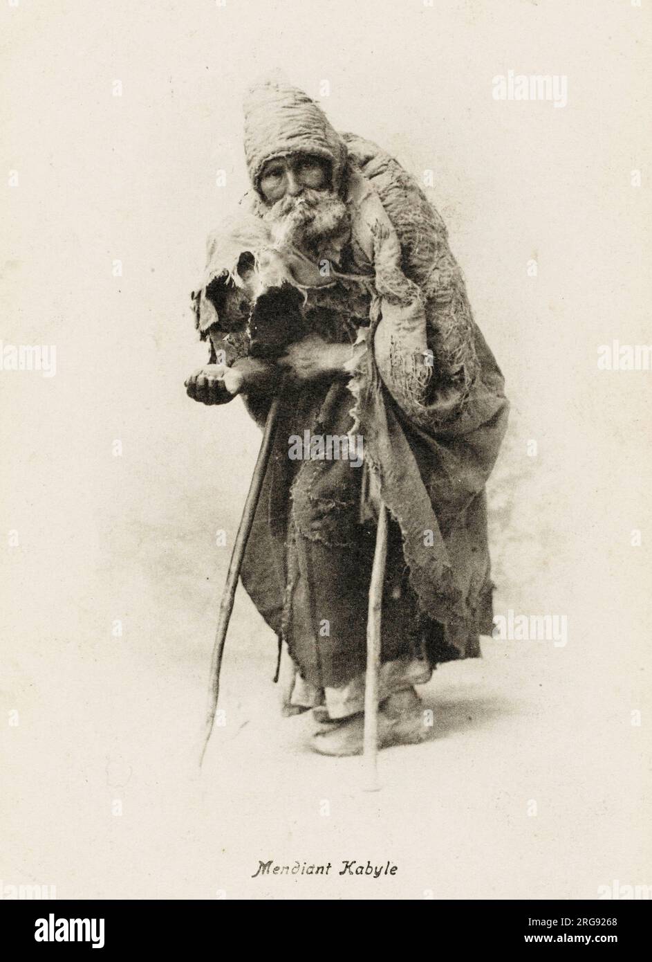 Algerian beggar from Kabyle - a Berber people whose traditional homeland is highlands of Kabylie (or Kabylia) in northeastern Algeria. Stock Photo