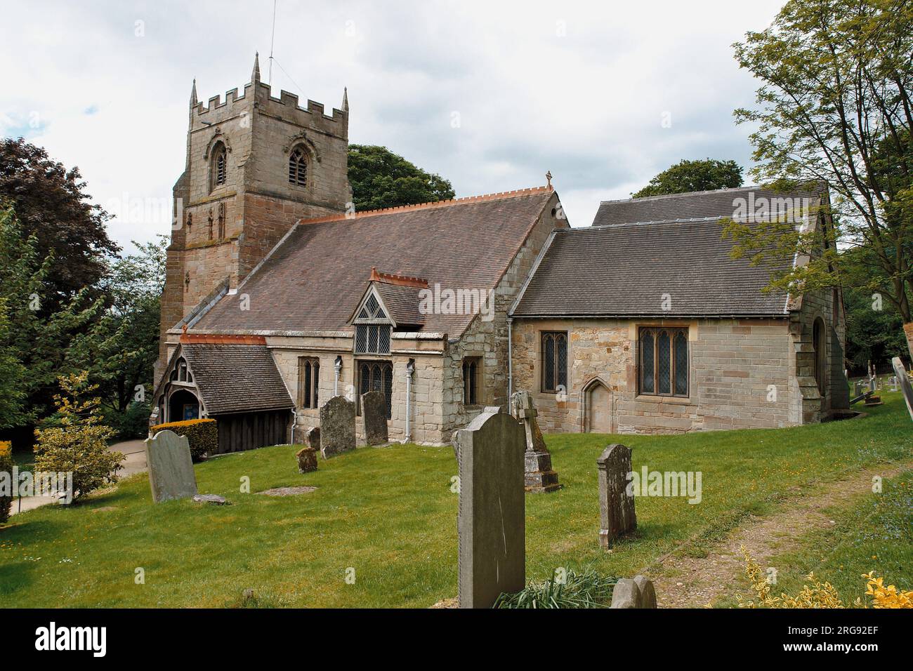 View of Beoley Church near Redditch, Worcestershire, across the cemetery.  The church is dedicated to St Leonard. Stock Photo