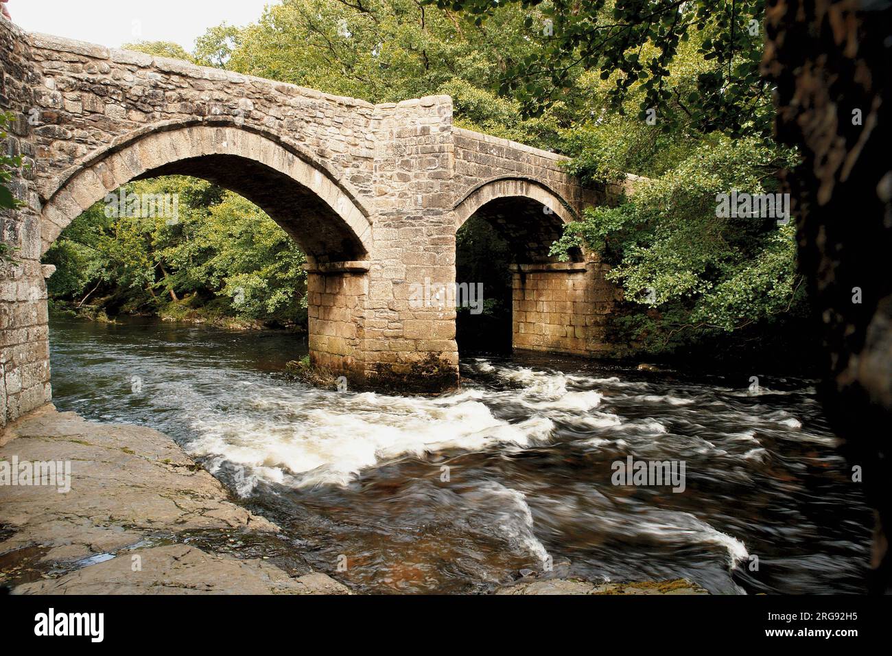 A medieval bridge over the River Dart at Newbridge, or New Bridge, on