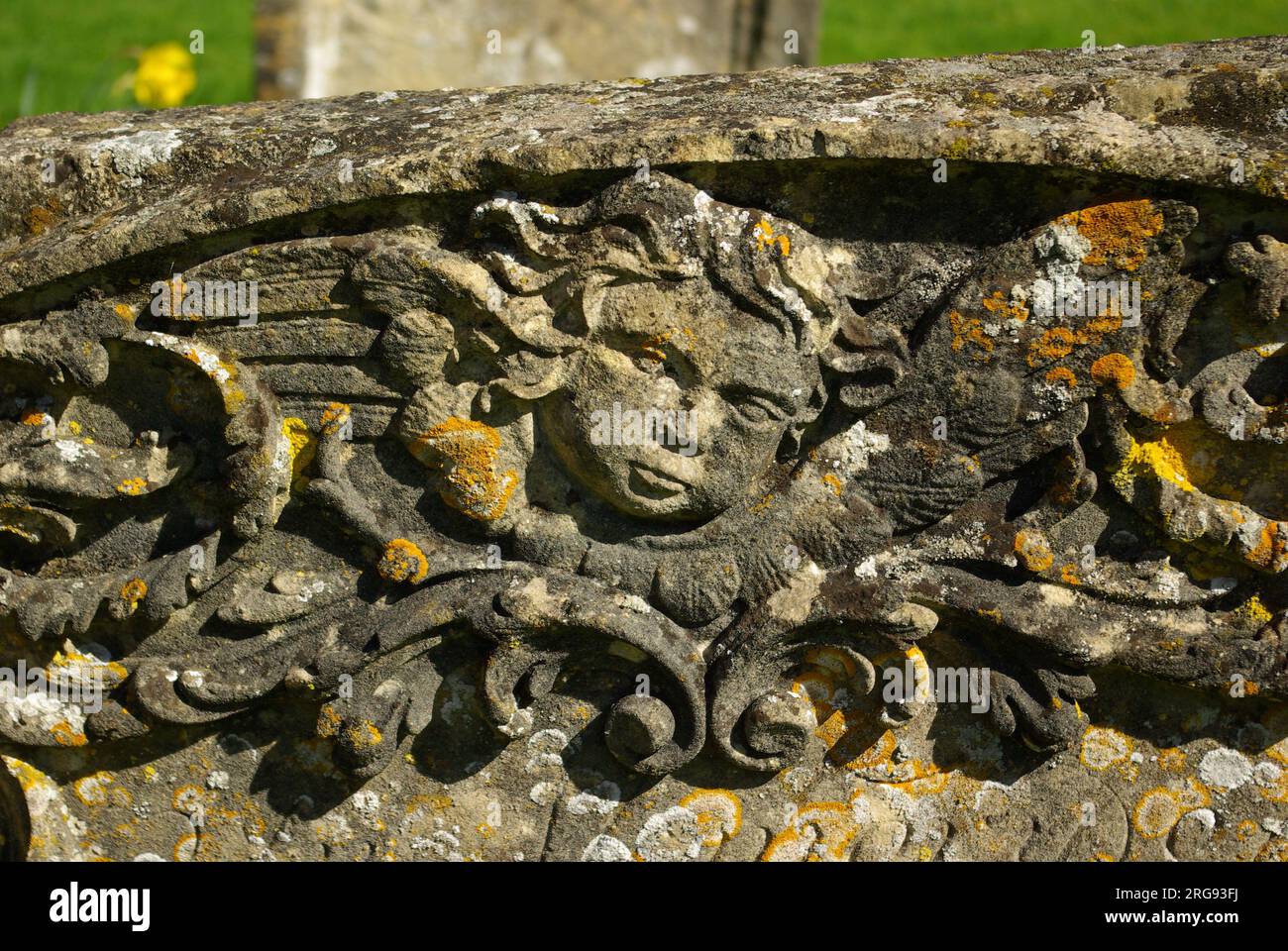 Tombstone detail in the churchyard of St Mary's Church, in the village of Bibury, Cotswolds, Gloucestershire. Stock Photo