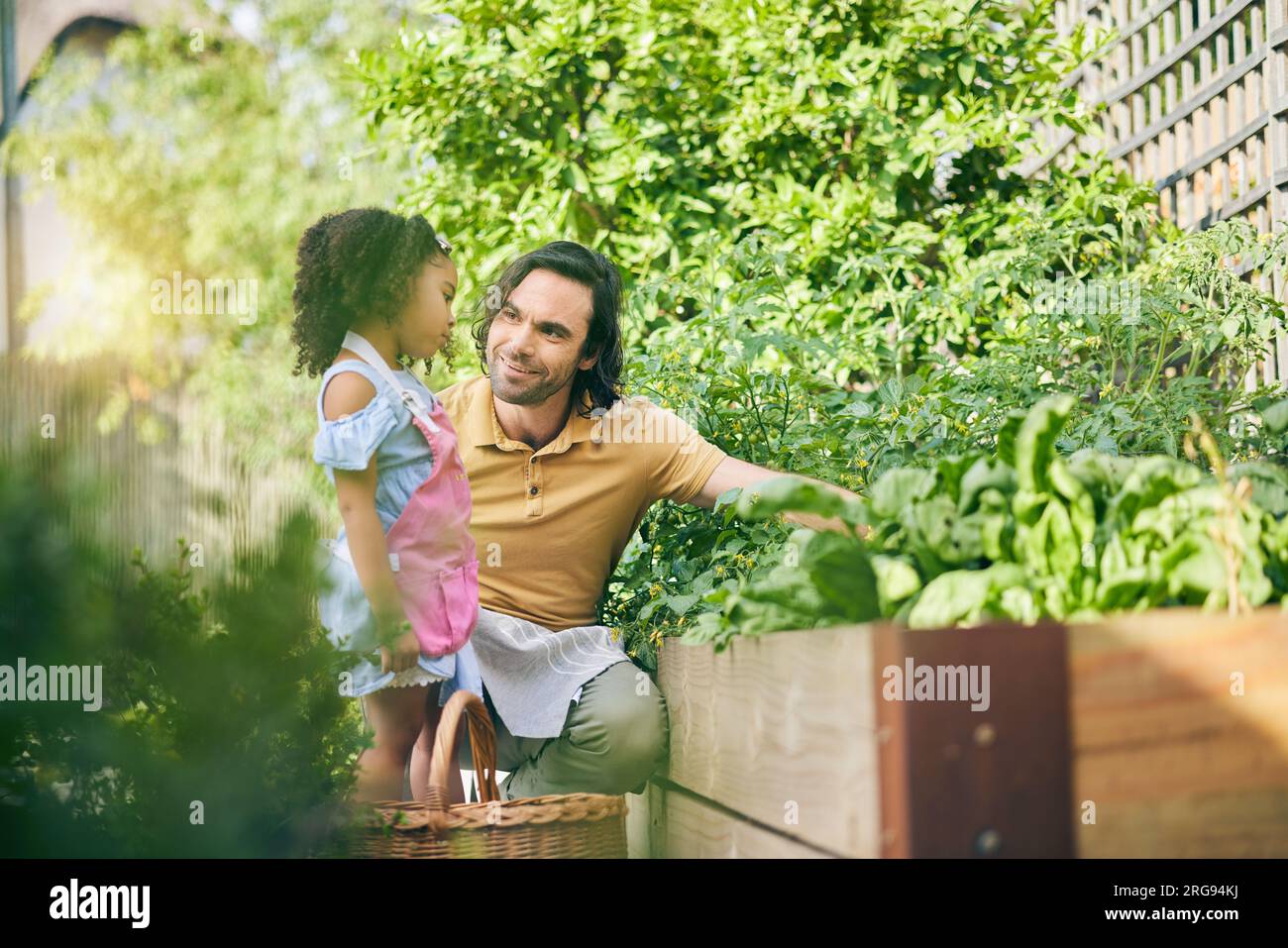 gardening-dad-and-child-with-plants-teaching-and-learning-with-growth