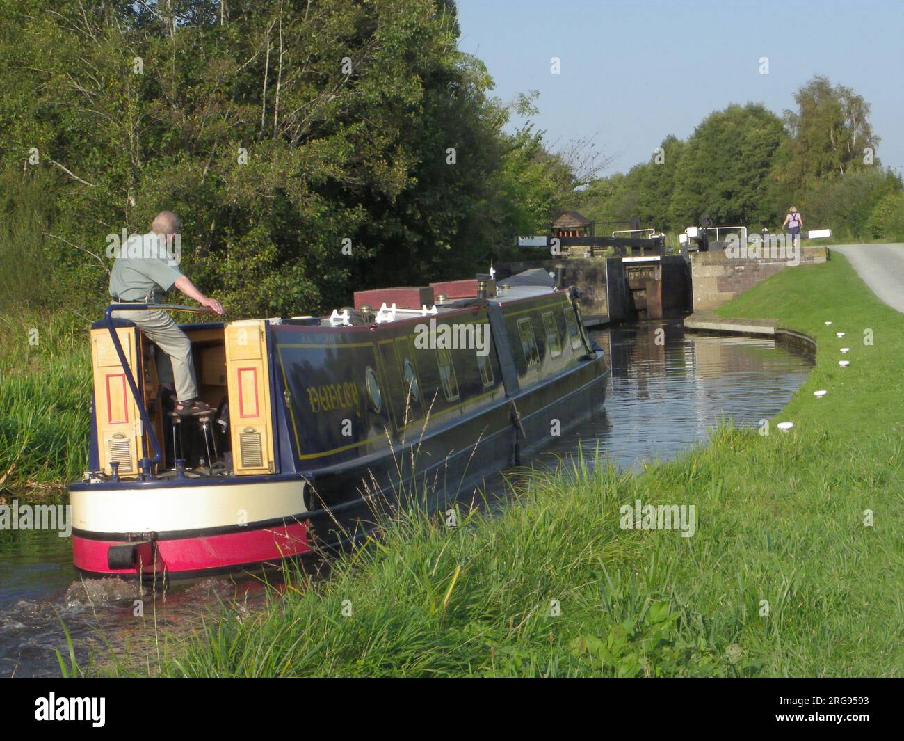 View at Aston Locks on the Montgomery Canal, which stretches from eastern Wales into north west Shropshire.  Showing a barge in the foreground. Stock Photo