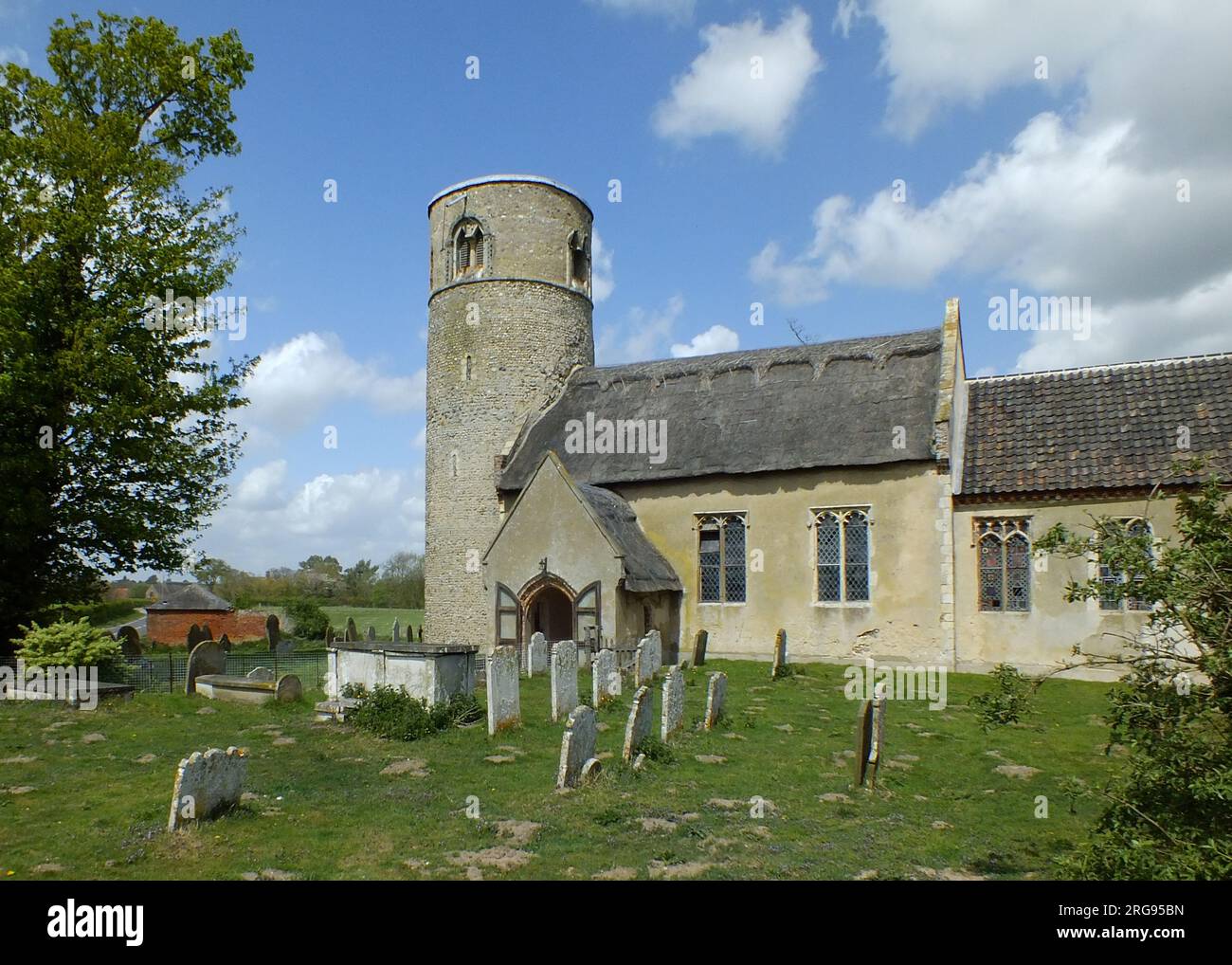 St Margaret's Church in the village of Herringfleet, near Somerleyton, Suffolk, dating back to medieval times, with later additions.  Unusually, it has a round tower rather than a square one. Stock Photo