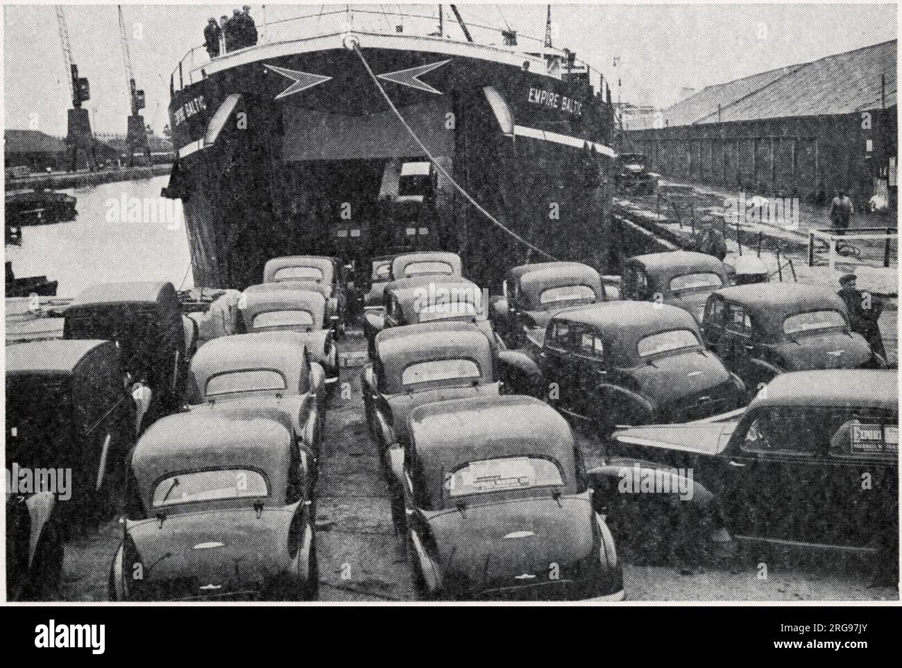 Post-WW2 export trade of cars from the UK to the European mainland, using a former wartime tank landing craft. Stock Photo