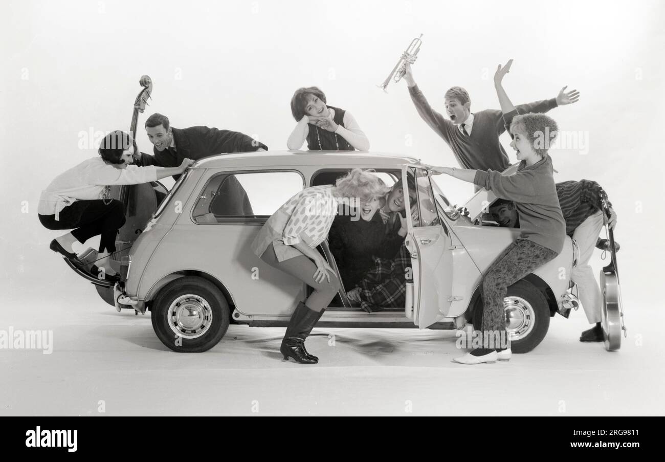Advertisement for CPV (Colman Prentis & Varley) - group of Beatniks (some holding musical instruments!) trying to squeeze into an Austin A7 (1/4). Stock Photo