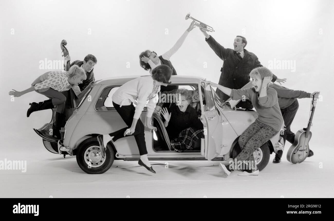 Advertisement for CPV (Colman Prentis & Varley) - group of Beatniks (some holding musical instruments!) trying to squeeze into an Austin A7 (3/4). Stock Photo