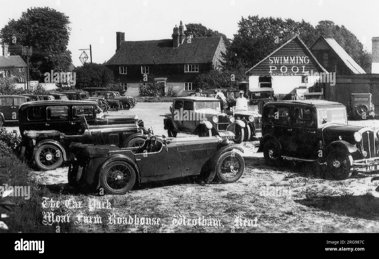 View of Moat Farm roadhouse in Wrotham, Kent.  Roadhouses became established in Britain during the inter-war years, particularly in the south-east and suburbs of London as increased car ownership caused people to seek venues that combined leisure facilities with motoring.  Roadhouses often began as petrol stations or were already inns, but they variously offered dining, dancing, cabaret, cocktails and, in the case of Moat Farm, a swimming pool.  Moat Farm still operates today as a pub, and uses its fourteenth century barn for functions.  However, the swimming pool is long gone. Stock Photo