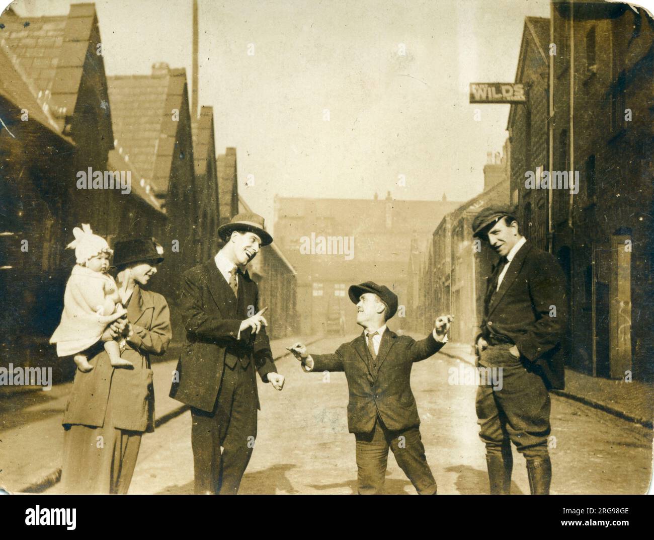 Group of people, possibly family members, including a man of restricted growth (dwarfism), 1920s. Stock Photo
