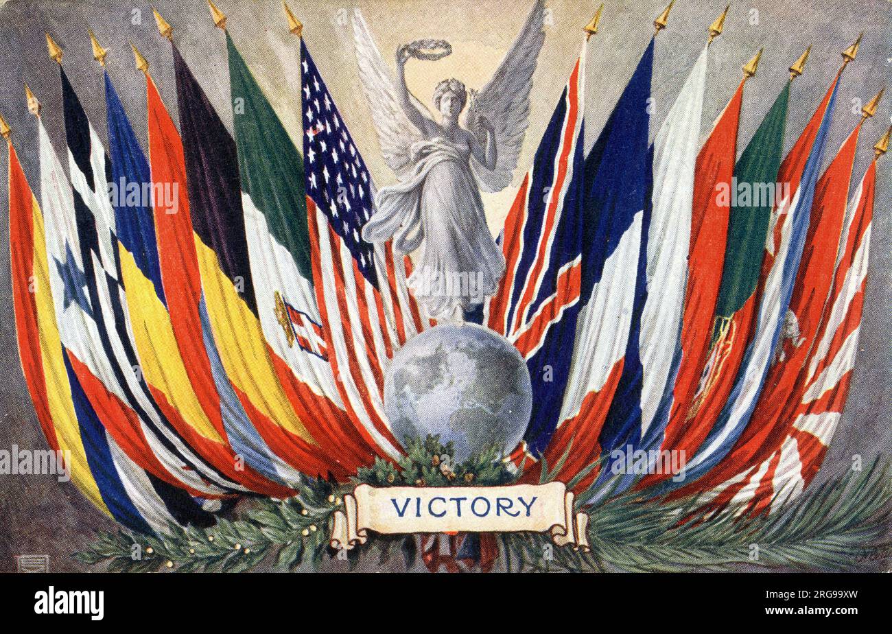 WW1 - Victory - The flags of the victorious nations flanking a carved statue of the personification of Victory stood atop the world and holding a victory wreath aloft. Stock Photo