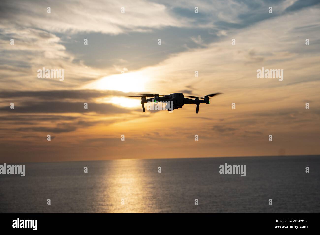 Aerial Symphony: Drone's Flight into the Sunset Stock Photo