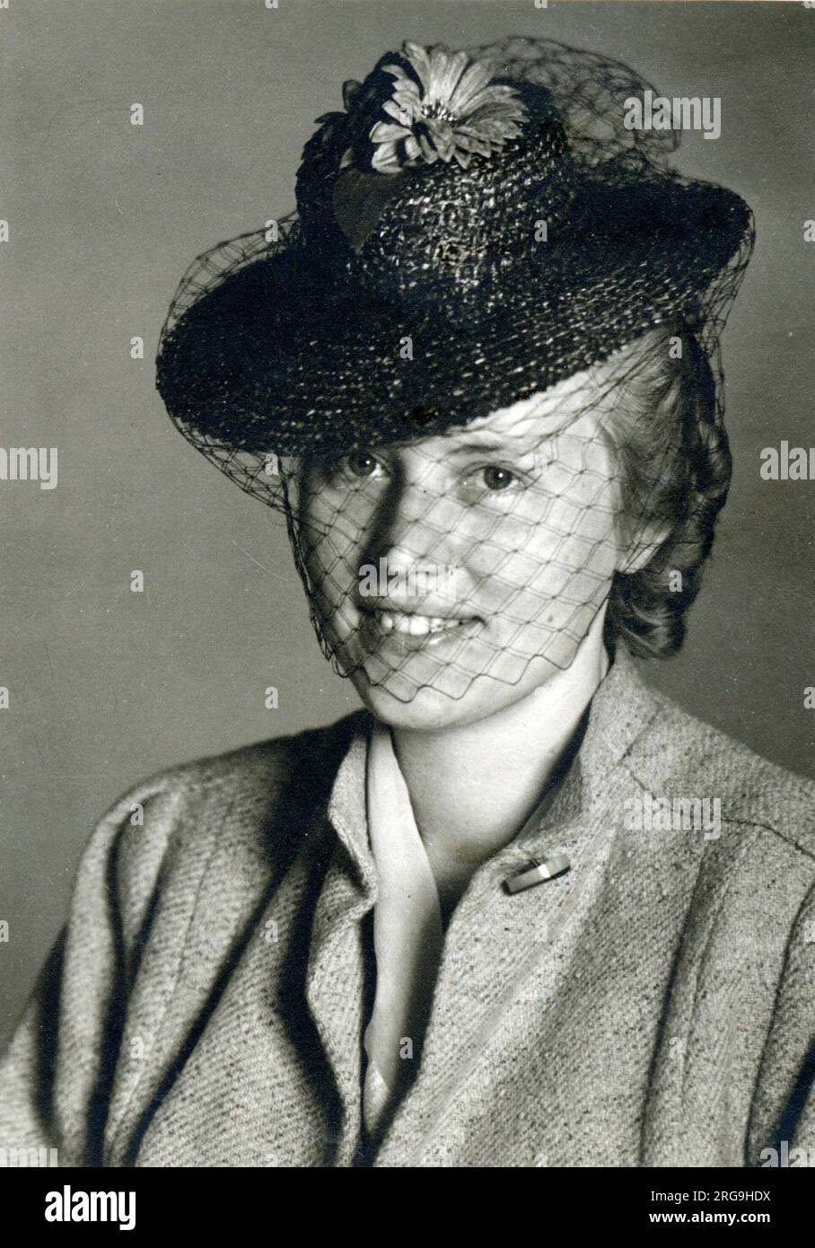Young German Woman wearing a small black hat with a veil. Stock Photo