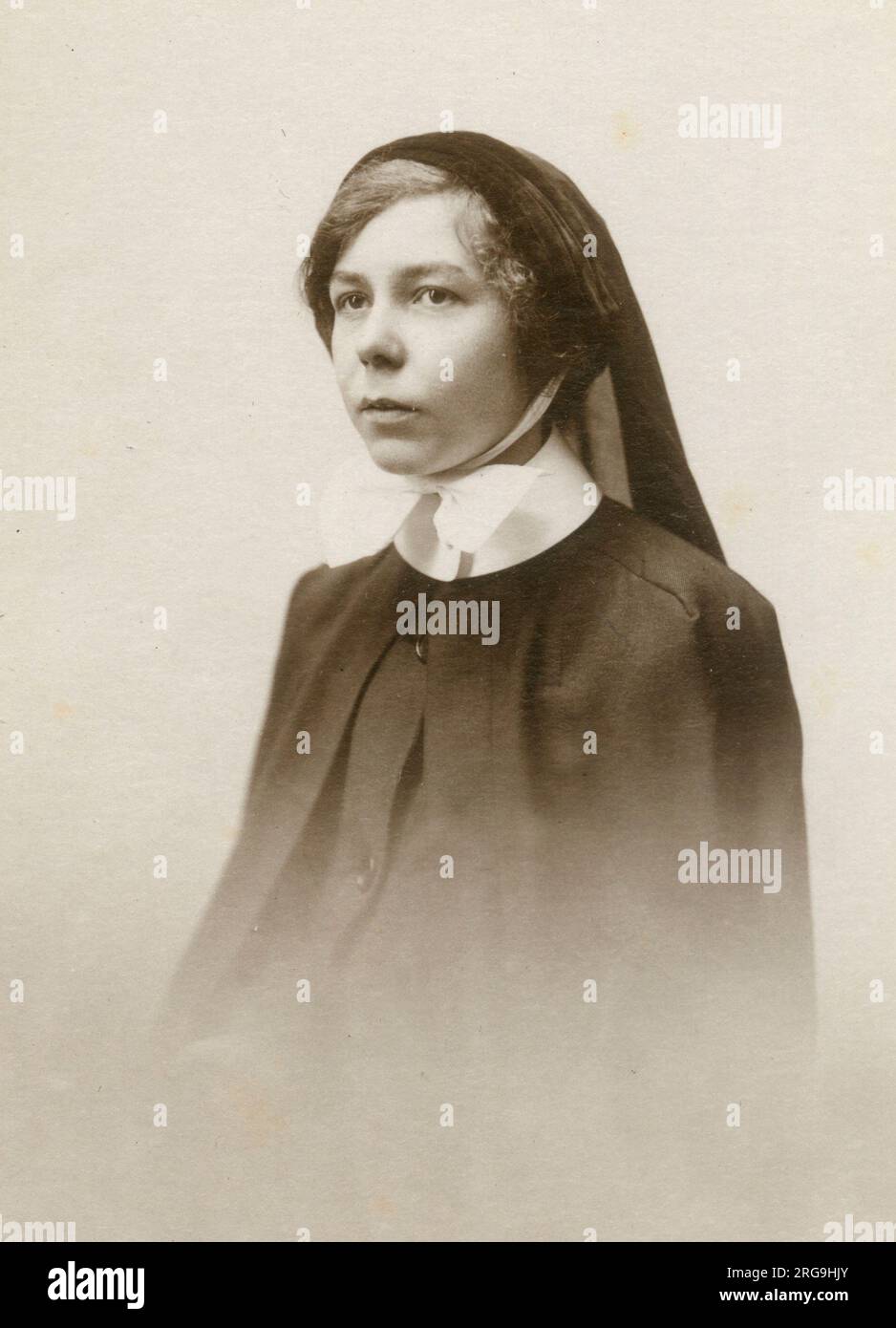 A Studio portrait photograph of a young nurse in her uniform - North East England. WW1 era. Stock Photo