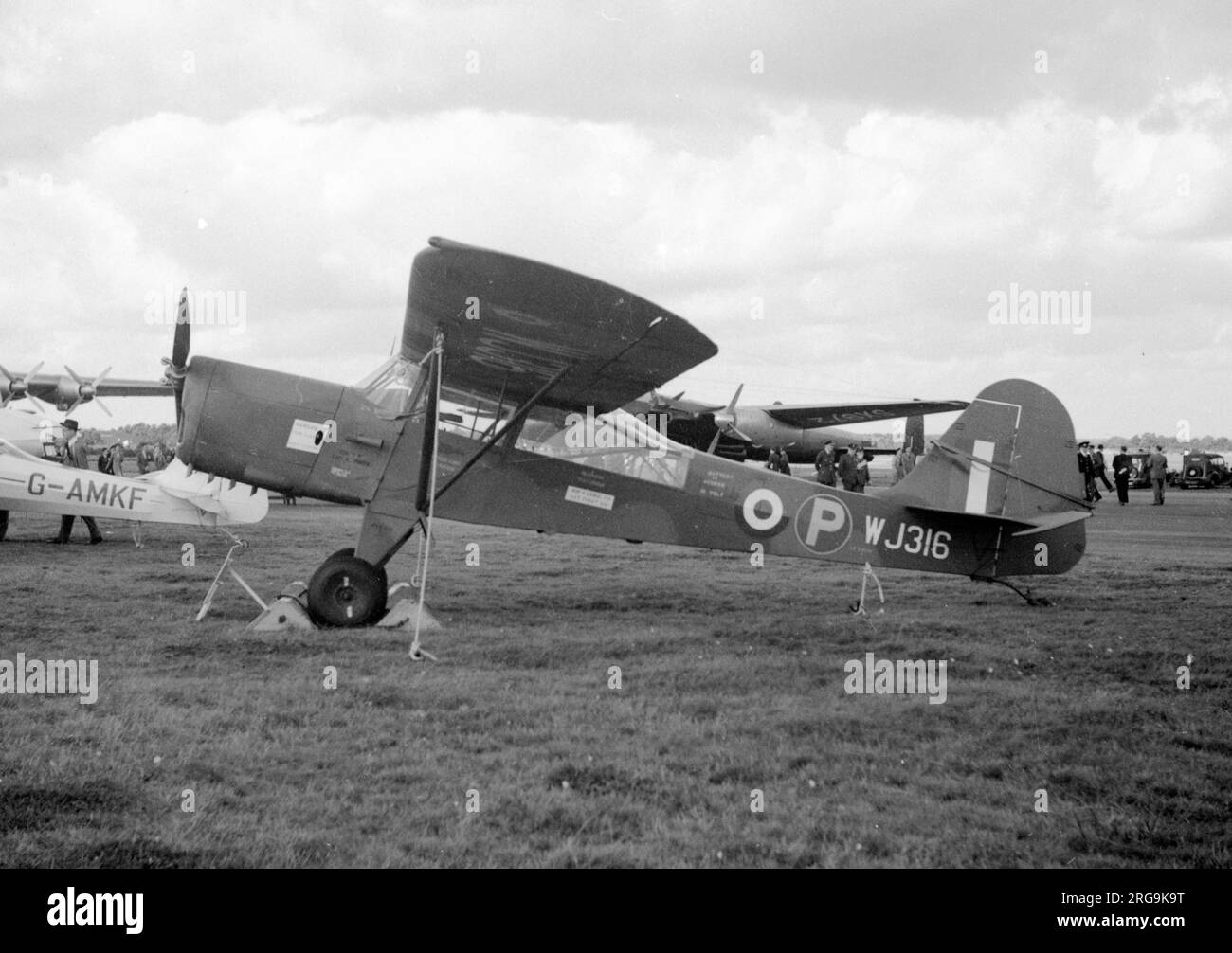 Royal Air Force Auster S WJ316, at the 1951 SBAC Farnborough Air Show. First flown in August 1950 and written off on 29 September 1955. The Auster S was an AOP aircraft based on the Auster 6, with enlarged tail, one prototype only. In the background can be seen the Avro Proteus-Lincoln test-bed SX972 and the Blackburn and General Universal Freighter WF320. Stock Photo