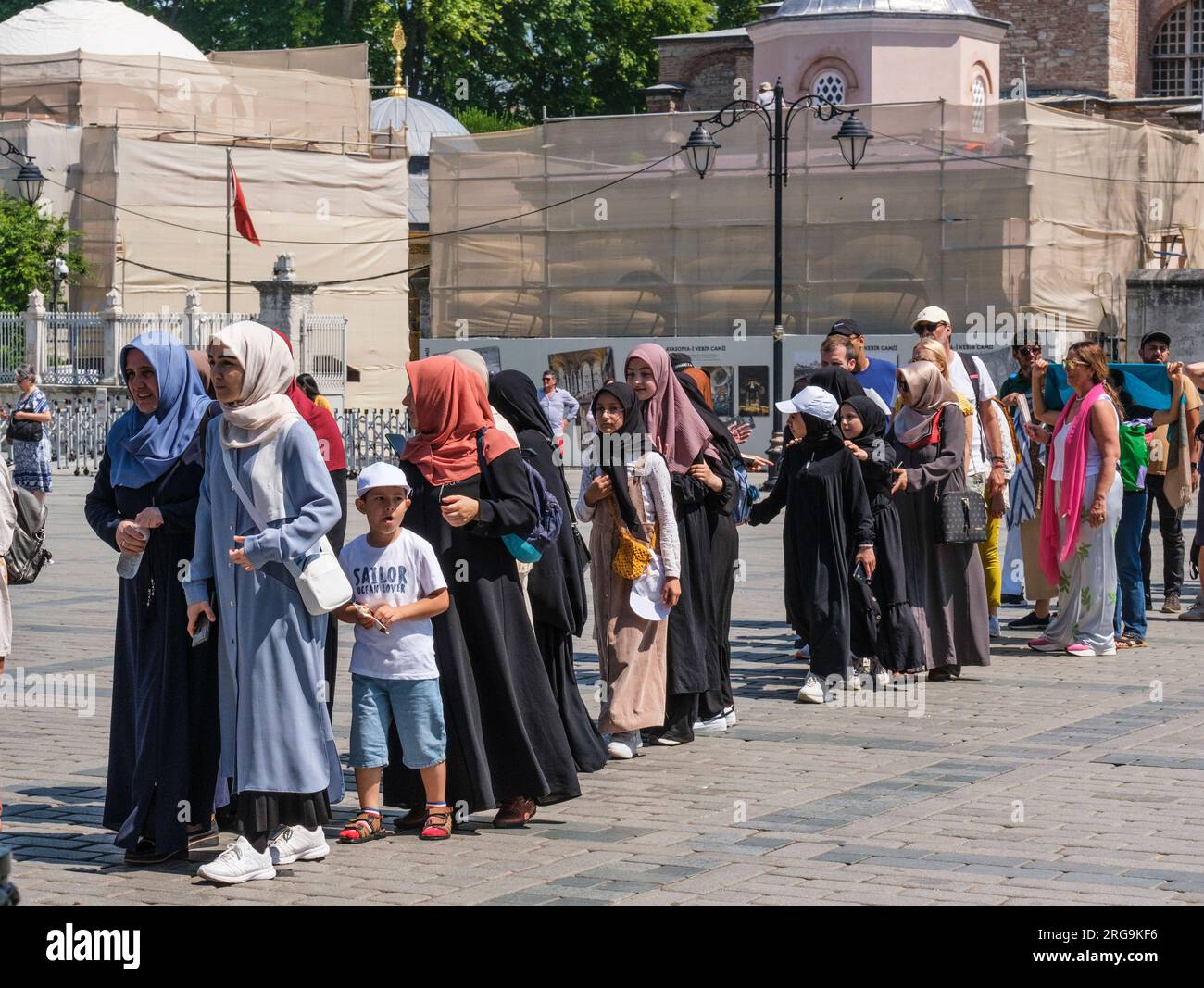 Istanbul, Turkey, Türkiye. Tourists Waiting in Line to Enter Hagia Sophia. Stock Photo