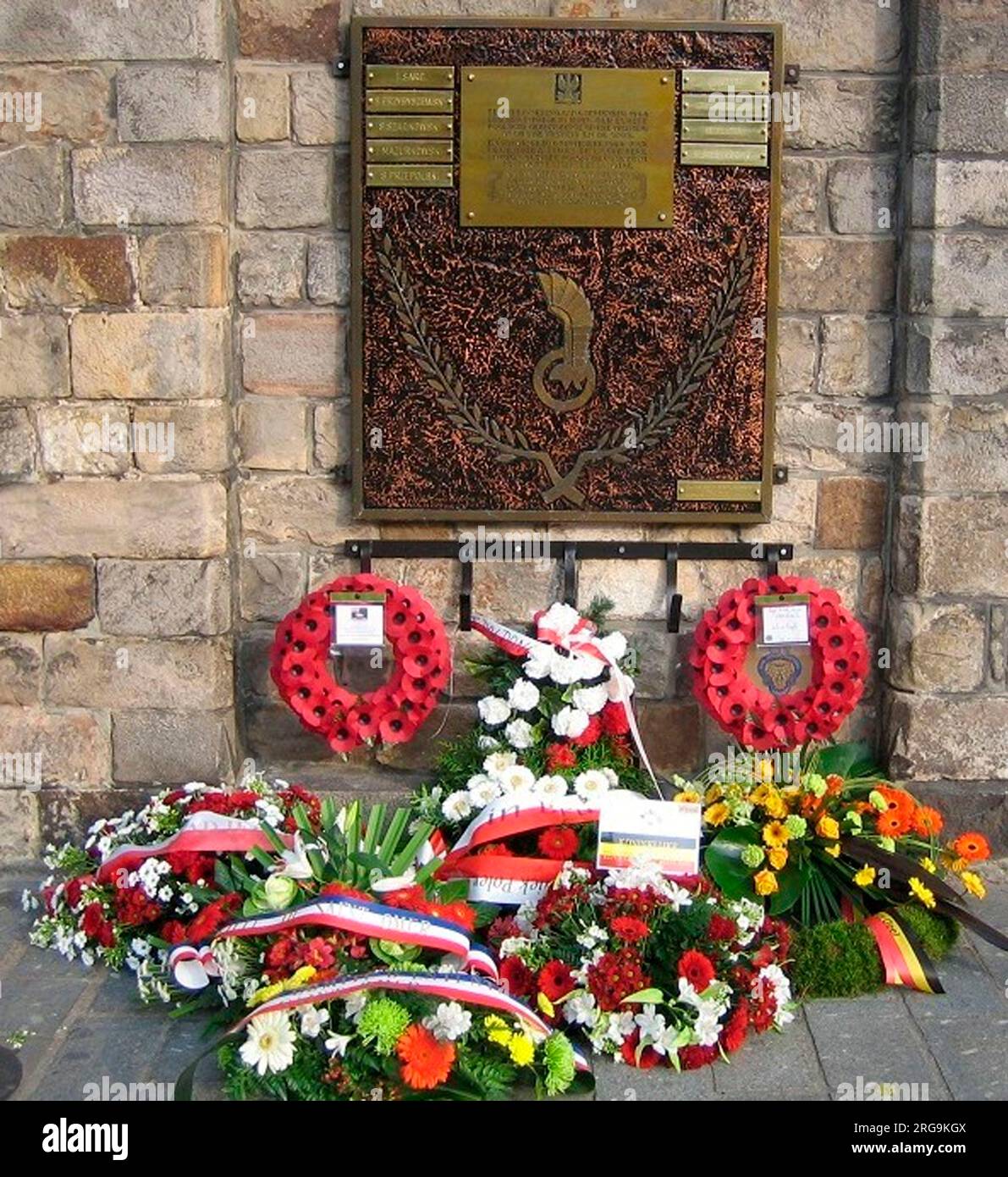 The memorial, which is on an outside wall, commemorates the Polish Forces who liberated Ypres in September 1944. In September 2016 researcher Chris Lock discovered that three Polish soldiers were not named and these have now been added - Lt. S. Strachowski, Sgt S. Struzik and Private B. Otreba. Stock Photo