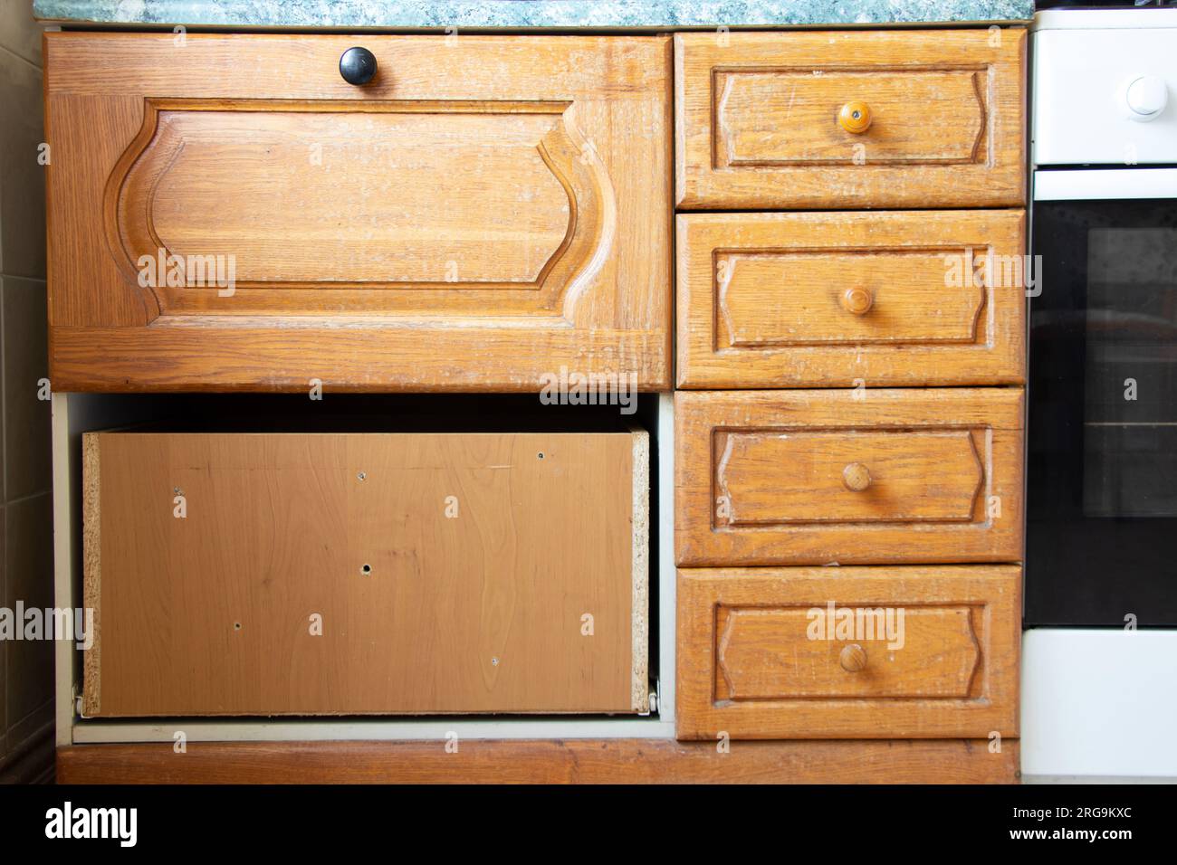 Old wooden kitchen cabinet in the kitchen in the Ukrainian apartment ...
