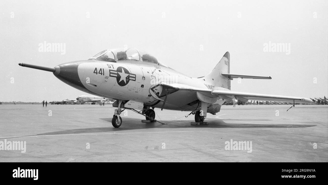 United States Navy - Grumman YF9F-8T Cougar 142441 (Grumman G-105) of the Naval Air Test Centre (NATC - NAS Patuxent River). Redesignated TF-9J in 1962 142442 became an NTF-9J for unspecified test purposes. Preserved at the William Krieger Memorial Park at Woodridge, NY. in a Blue Angels colour scheme code 7. Stock Photo