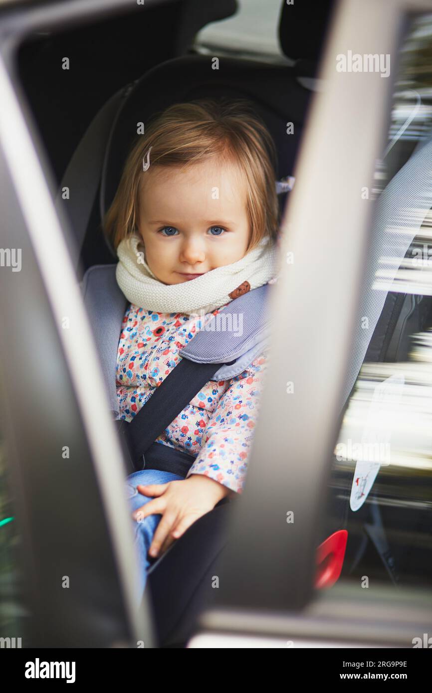 Toddler sleeping in Joie Trillo Shield Car Seat Stock Photo - Alamy