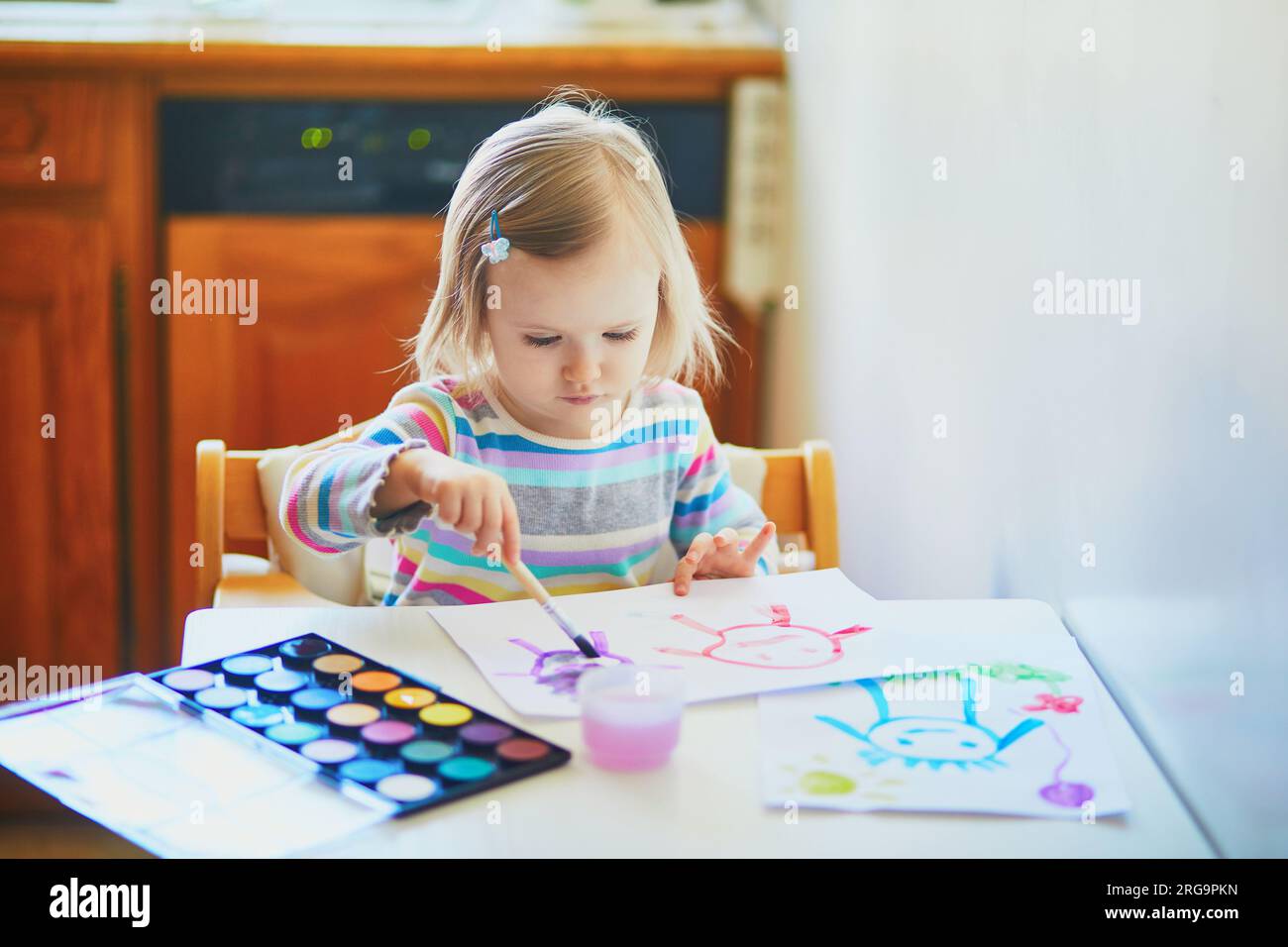 Toddler painting at home Stock Photo - Alamy