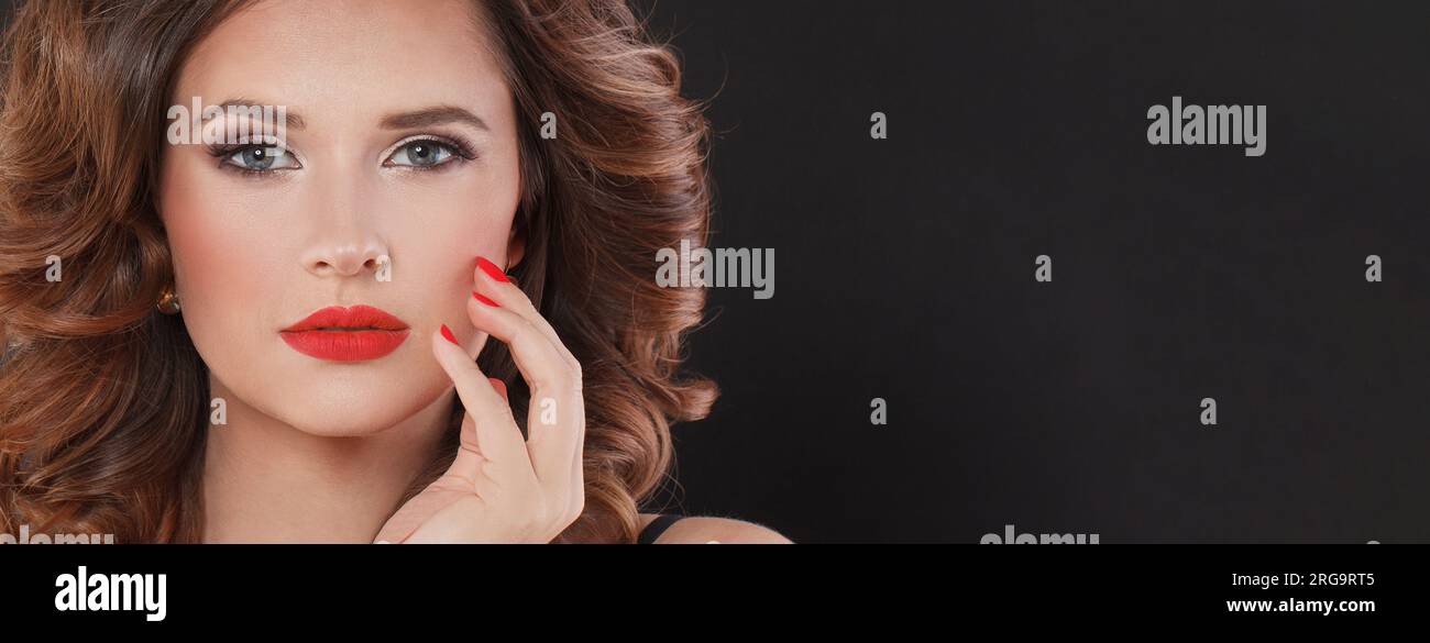 Female face closeup. Glamorous model woman with red lips and red nails ...