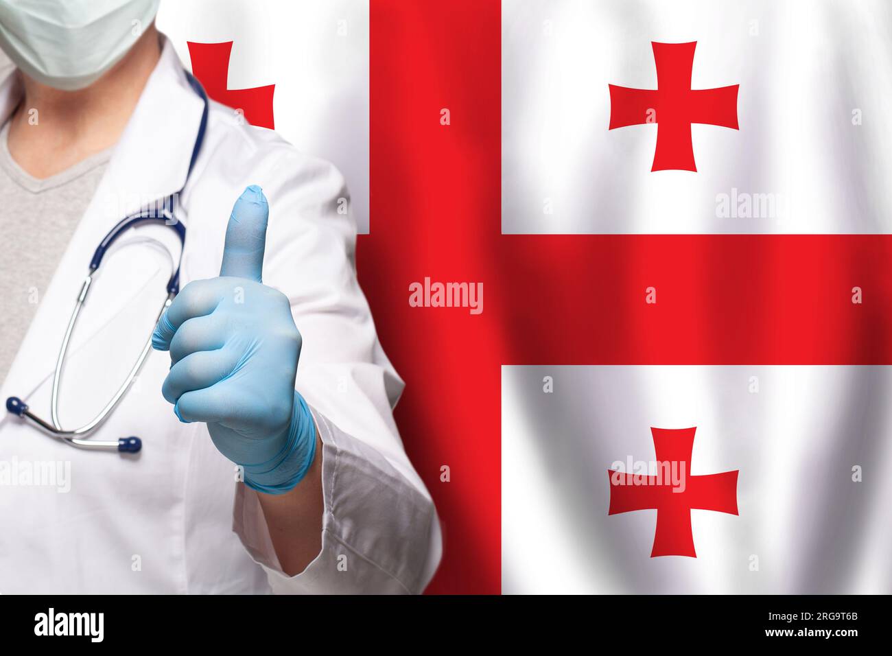 Georgian doctor's hand showing thumb up positive gesture on flag of ...
