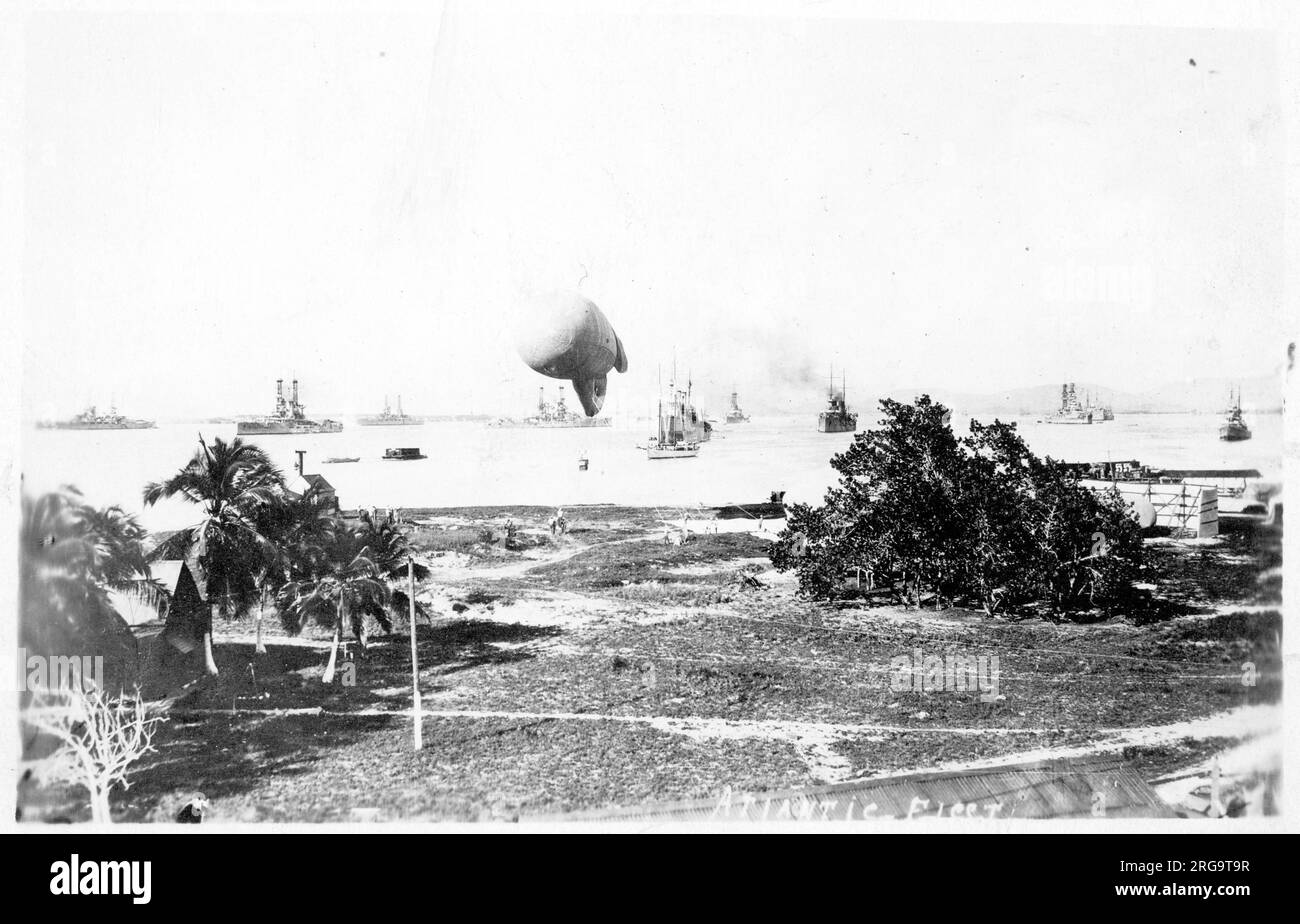 United States Navy - Atlantic Fleet in harbour, including the Illinois-class battleships USS Alabama and USS Illinois, distinctive for having side-by side funnels. An observation ballon is inflated and picketed in the foreground. It is unclear where this was taken, though it could be in the Caribbean or South America. Alternatively it is possible this is a photo of the assembled Great White Fleet, which conducted a world tour in 1907, returning in 1909. Stock Photo