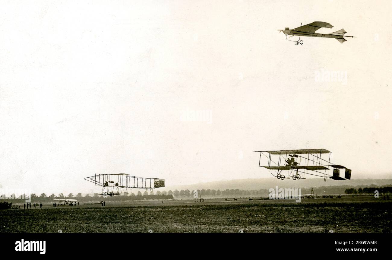 Hubert Latham in his Antoinette IV, with Henry Farman in his Farman III biplane and roger Sommer, also flying a Farmn III at the Grande Semaine d'Aviation de la Champagne, held near Reims in France.(cropped) Arthur Charles Hubert Latham:- (10 January 1883 - 25 June 1912) was a French aviation pioneer. He was the first person to attempt to cross the English Channel in an aeroplane. In August 1909 at the Grande Semaine d'Aviation de la Champagne he set the world altitude record of 155 metres (509 ft) in his Antoinette IV as well as a world speed record at 42 mph. Henry Farman:- (26 May 1874- 17 Stock Photo