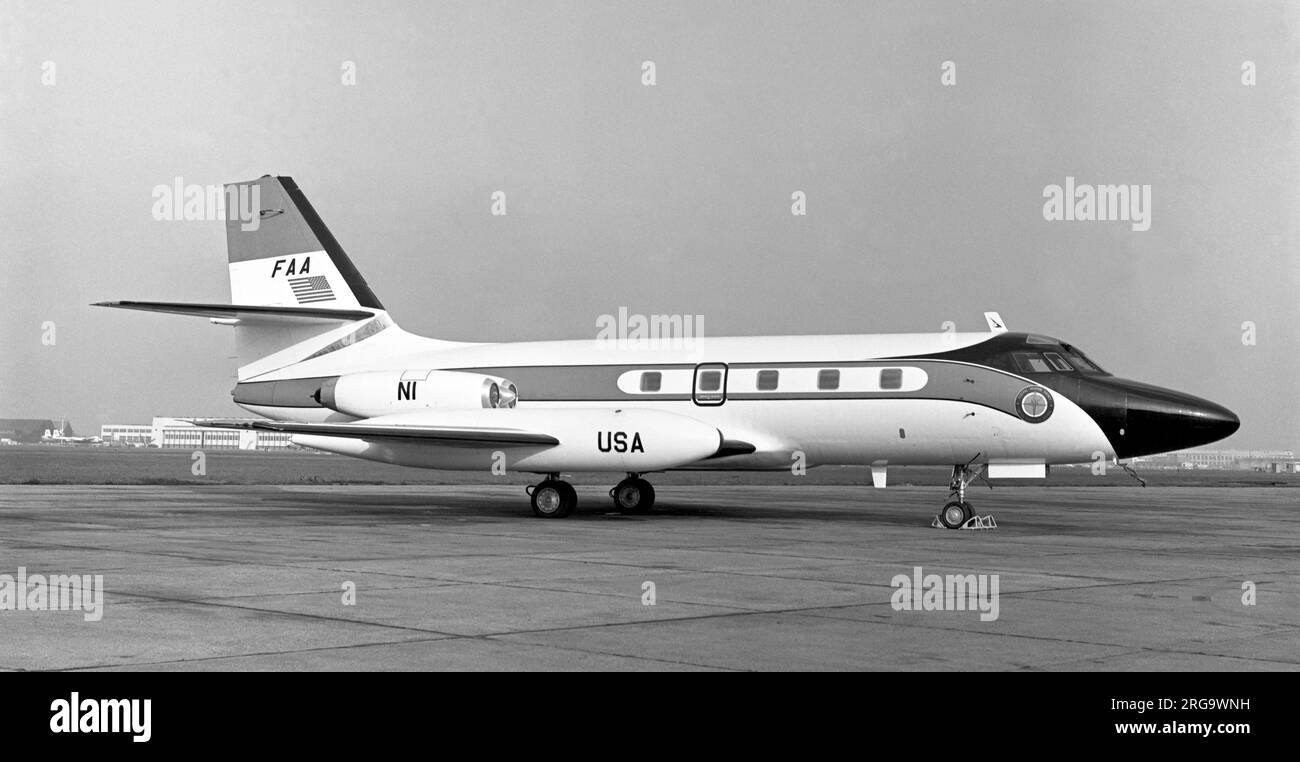 Lockheed JetStar N1 of the Federal Aviation Administration flying unit, at London Heathrow Airport. Of note is the BEA (British European Airways) Armstrong Whitworth Argosy in the background. Stock Photo