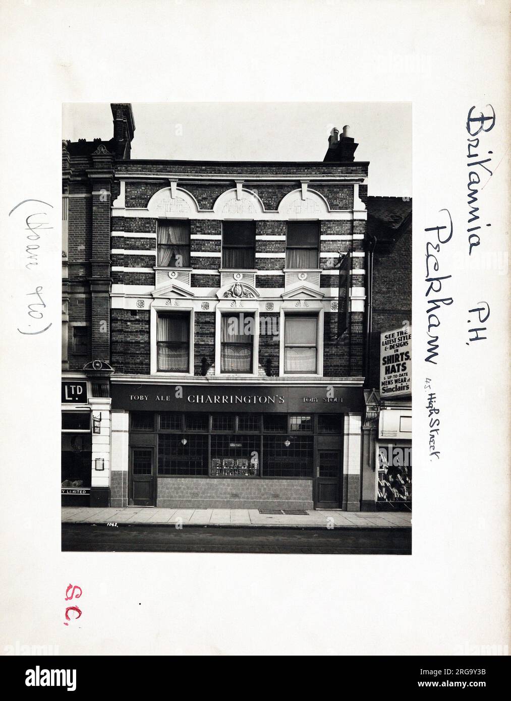 Photograph of Britannia PH, Peckham, London. The main side of the print (shown here) depicts: Face on view of the pub.  The back of the print (available on request) details: Trading Record 1934 . 1961 for the Britannia, Peckham, London SE15 5RS. As of July 2018 . Now Elliot's clothes shop. Stock Photo