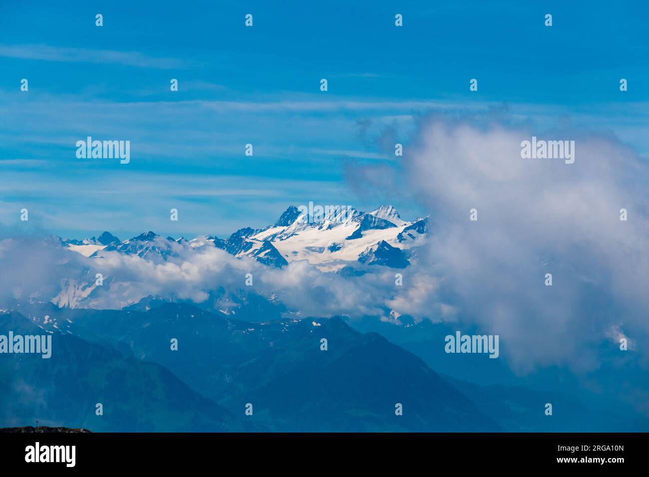Lovely close-up view of the alps seen from the panorama terrace at the Pilatus Kulm mountain station. On clear days, the alps are visible behind the... Stock Photo
