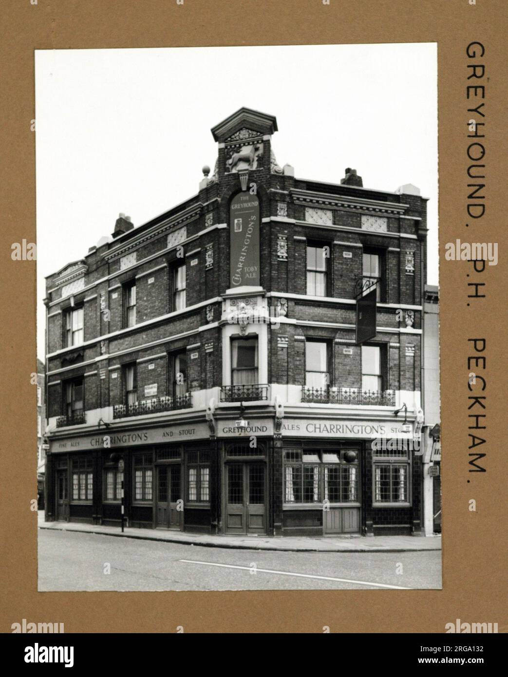 Photograph of Greyhound PH, Peckham, London. The main side of the print (shown here) depicts: Corner on view of the pub.  The back of the print (available on request) details: Trading Record 1940 . 1961 for the Greyhound, Peckham, London SE15 5SE. As of July 2018 . Individually owned Stock Photo