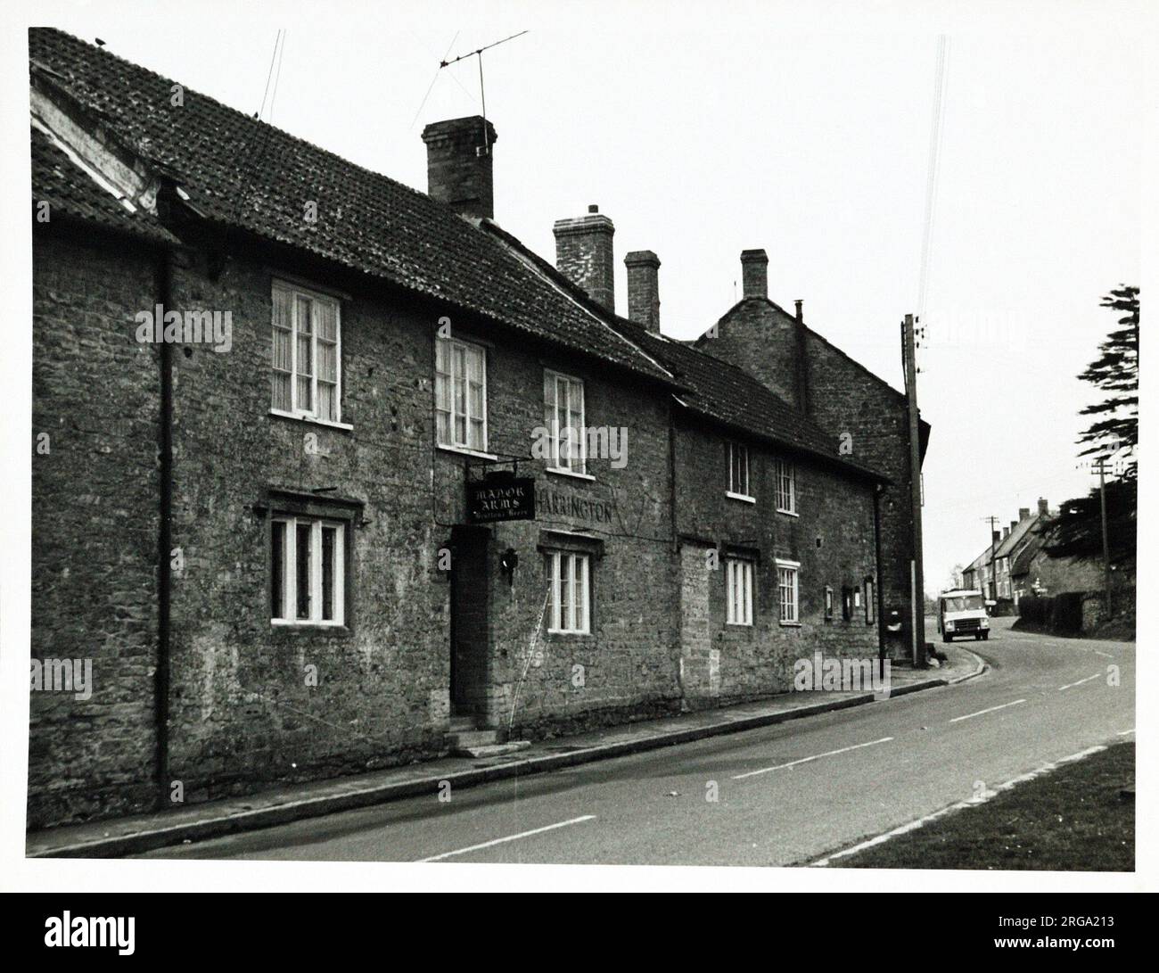 Photograph of Manor Arms, Crewkerne, Somerset. The main side of the print (shown here) depicts: Left Face on view of the pub.  The back of the print (available on request) details: Publican ID for the Manor Arms, Crewkerne, Somerset TA18 7SG. As of July 2018 . Individually owned Stock Photo