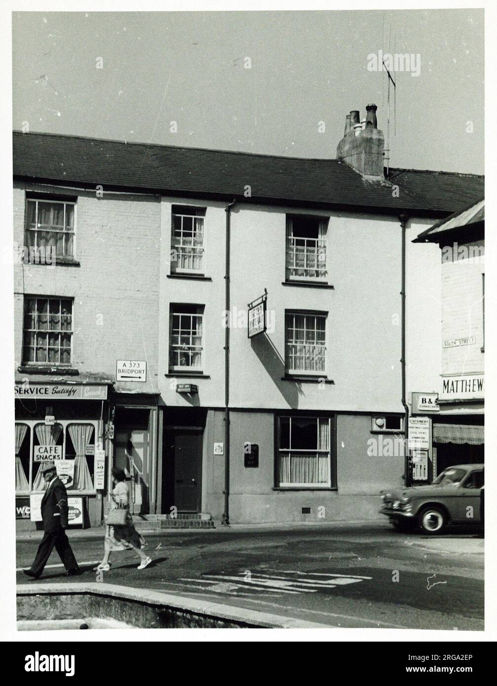 Photograph of Old White Hart Hotel, Axminster, Somerset. The main side of the print (shown here) depicts: Face on view of the pub.  The back of the print (available on request) details: Publican ID for the Old White Hart Hotel, Axminster, Somerset EX13 5AU. As of July 2018 . Now a weight loss centre Stock Photo