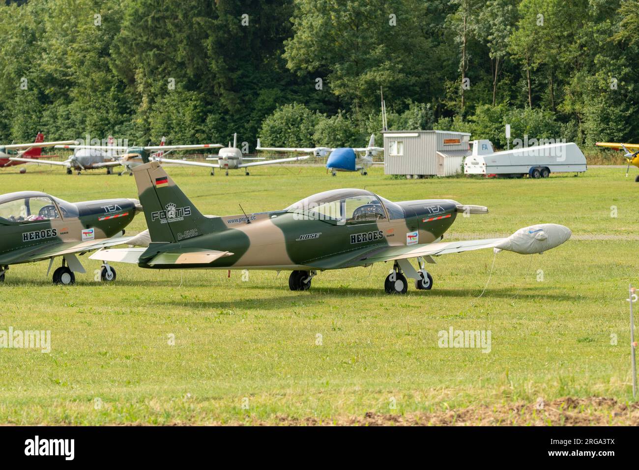 Speck-Fehraltorf, Zurich, Switzerland, July 1, 2023 Siai Marchetti SF-260 acrobatic aircraft is parking on a grass field Stock Photo