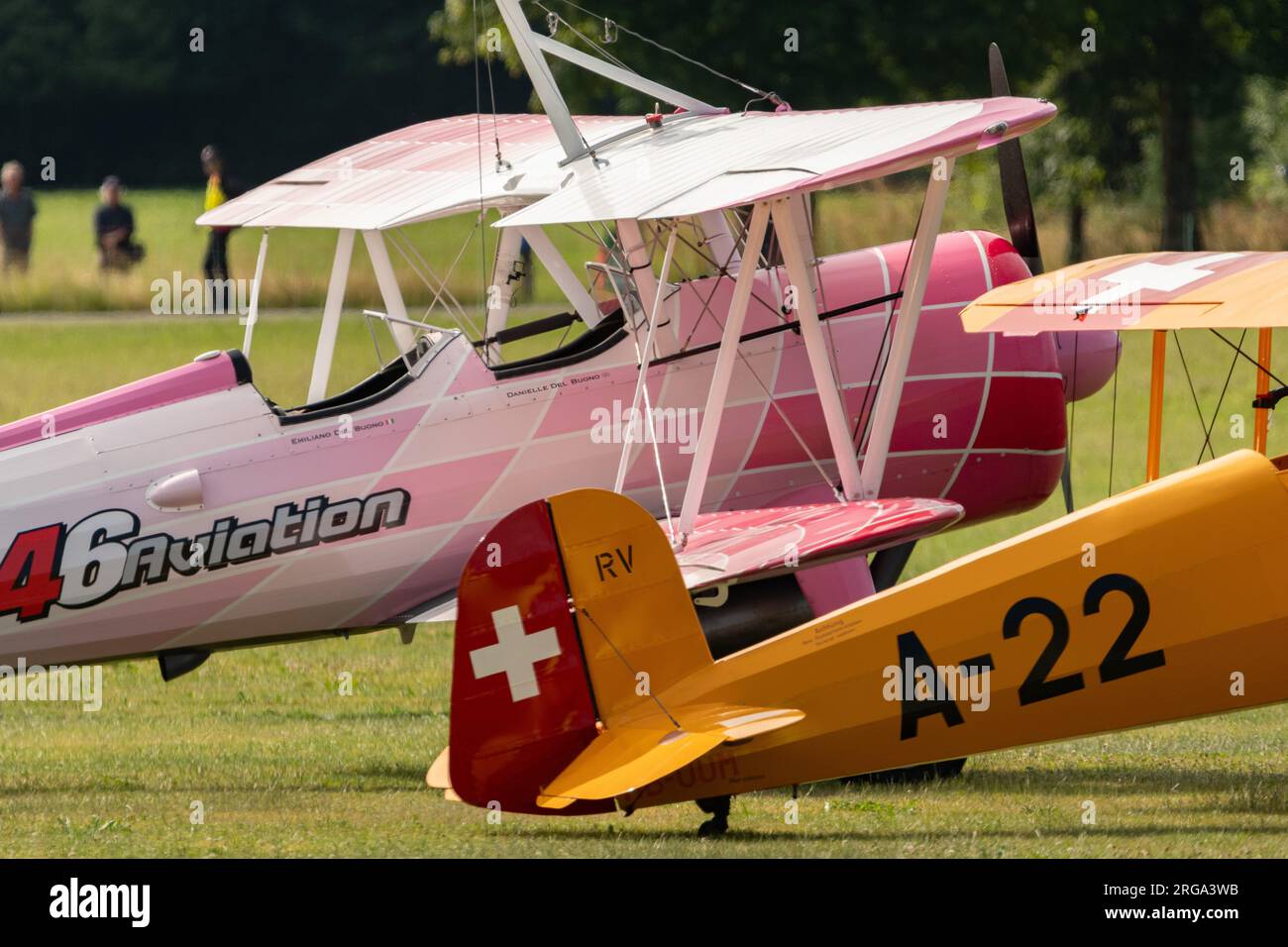 Speck-Fehraltorf, Zurich, Switzerland, July 1, 2023 Boeing PT-13D and a Dornier APM-131 Jungman acrobatic airplane are parking on the grass field Stock Photo