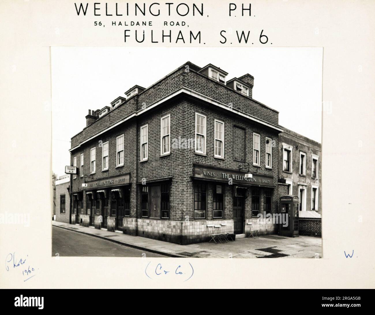 Photograph of Wellington PH, Fulham, London. The main side of the print (shown here) depicts: Corner on view of the pub.  The back of the print (available on request) details: Trading Record 1938 . 1961 for the Wellington, Fulham, London SW6 7EU. As of July 2018 . Owner . TWPF Ltd Stock Photo