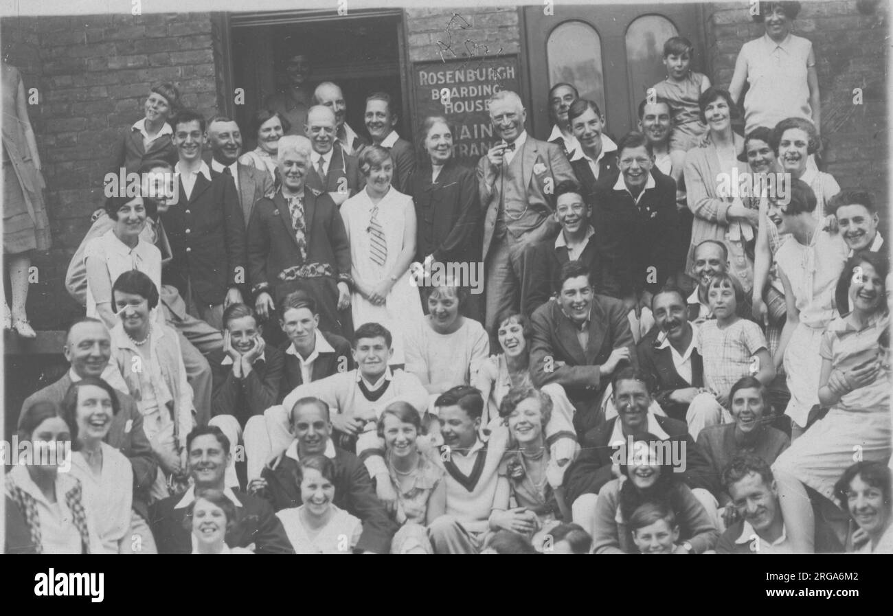 A jolly scene outside the Rosenburgh guest house in Margate, with all residents posed outside for an informal photograph. Stock Photo