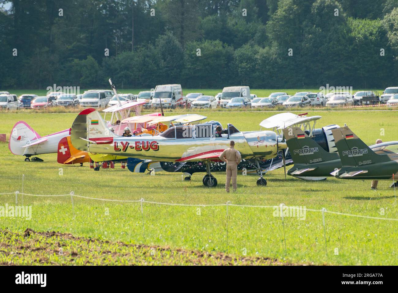 Speck-Fehraltorf, Zurich, Switzerland, July 1, 2023 Different historic propeller aircraft are parking on the grass apron Stock Photo