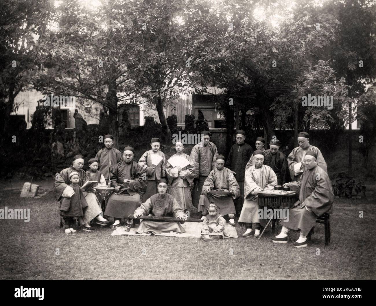 Vintage 19th century photograph: Group of Chinese men outdoors playing board games Stock Photo