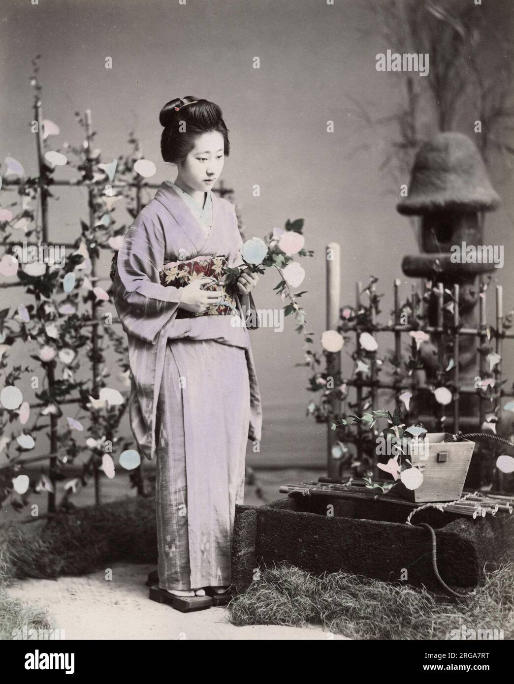 Geisha arranging flowers, Japan. Vintage 19th century photograph. Stock Photo